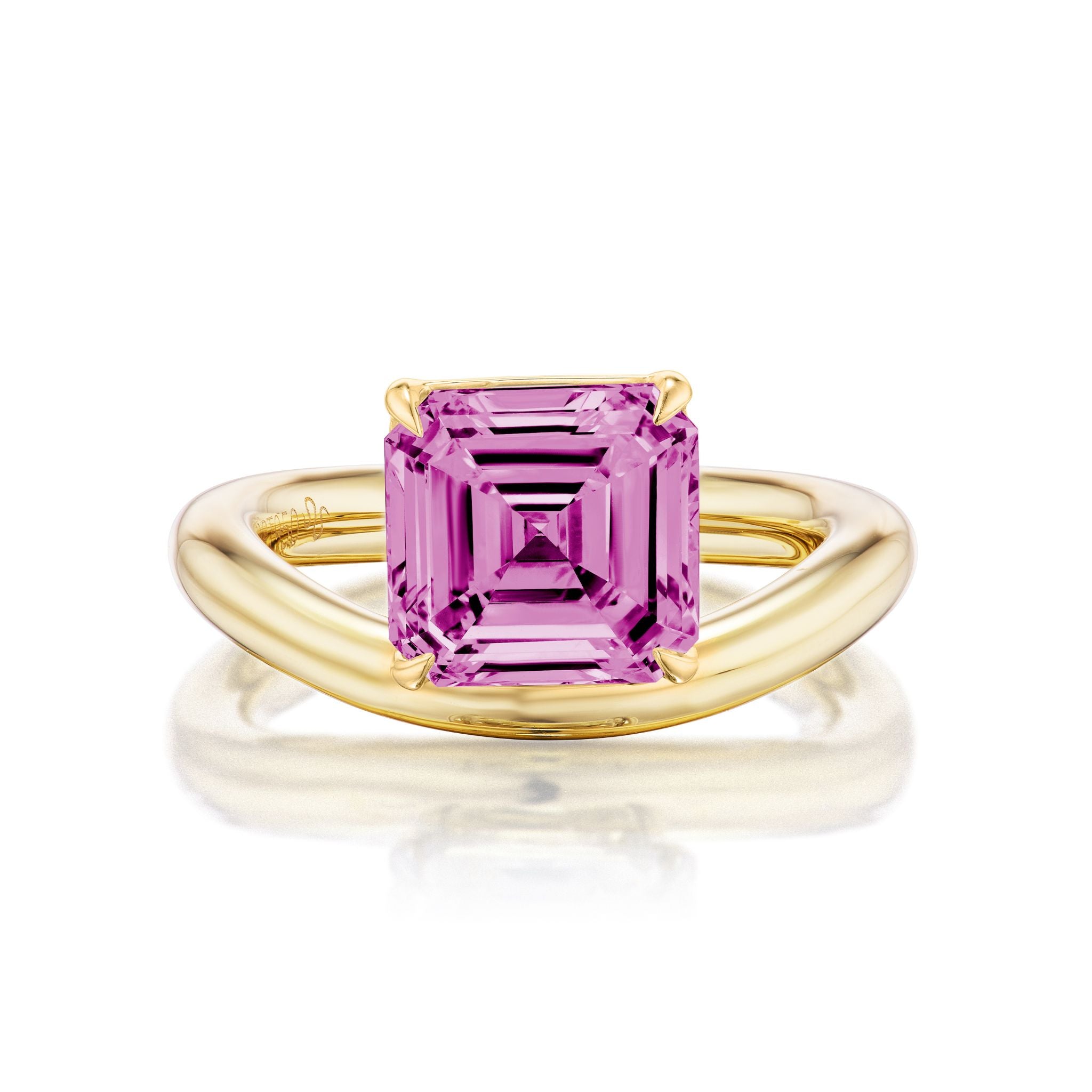 The Pinky Ring in Yellow Gold with Asscher Cut Pink Sapphire showcases a striking, large hot pink sapphire in an Asscher cut, elegantly set in a classic four-prong 18k yellow gold setting and presented on a plain white background.
