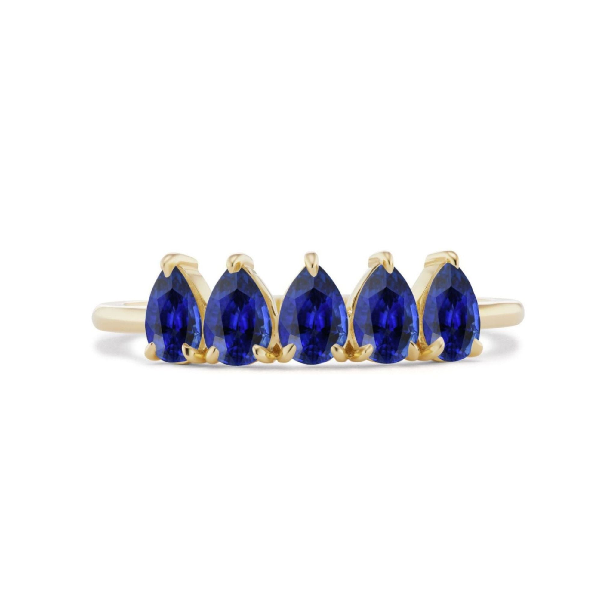 The North-South Set Pear Shape Blue Sapphire Ring in Yellow Gold features five pear-shaped blue sapphires arranged in a row, each secured by three prongs, showcasing a minimalist and elegant design in 18k yellow gold.
