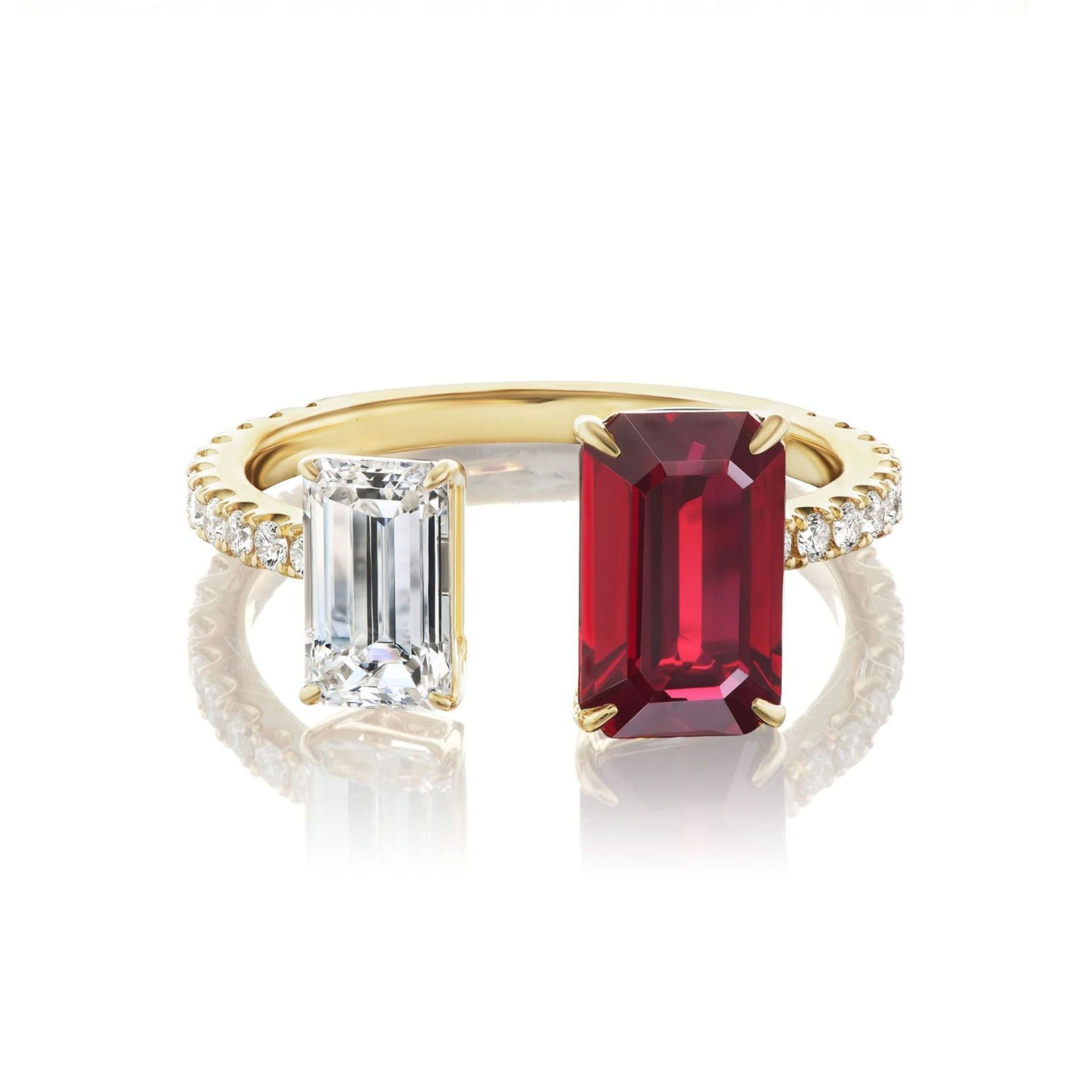 Introducing the Toi et Moi Pavé Ring with Emerald Cut Ruby and Diamond: a luxurious 18k yellow gold ring featuring pavé-set diamonds along the band, adorned with two striking emerald cut stones—a vibrant ruby and a clear diamond—set side by side for an elegant and captivating look.