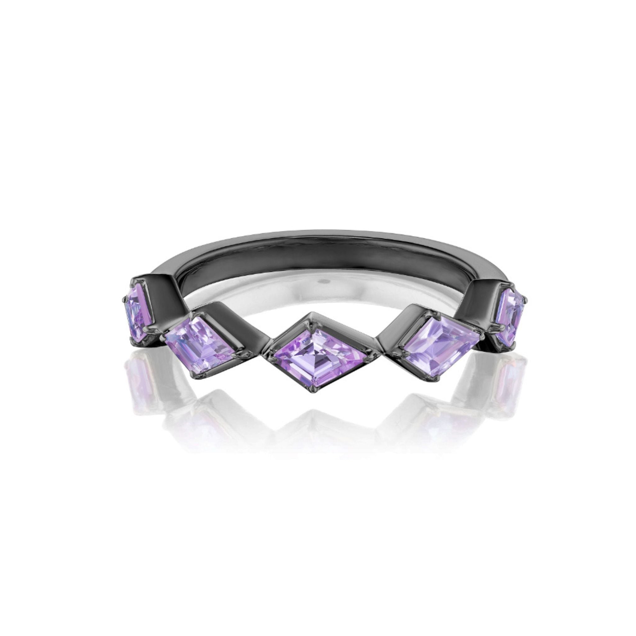 The Chasing Kites Purple Sapphire Half Eternity Band in Rhodium showcases five geometric, kite-shaped purple sapphires set in a striking zigzag pattern. Square and diamond-shaped stones are evenly arranged across the front of the shiny, reflective band.