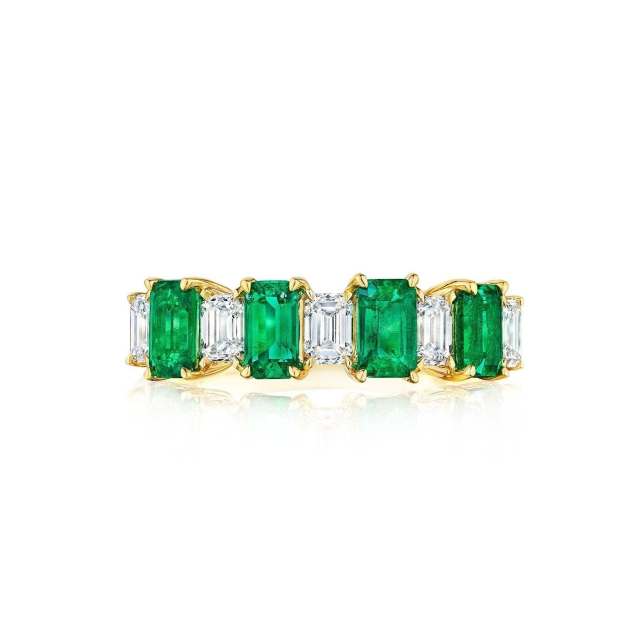Introducing the Chroma Alternating Emerald and Diamond Half Eternity Band, beautifully crafted in 18k gold and featuring rectangular green emeralds alternating with emerald-cut diamonds, elegantly displayed against a white background.