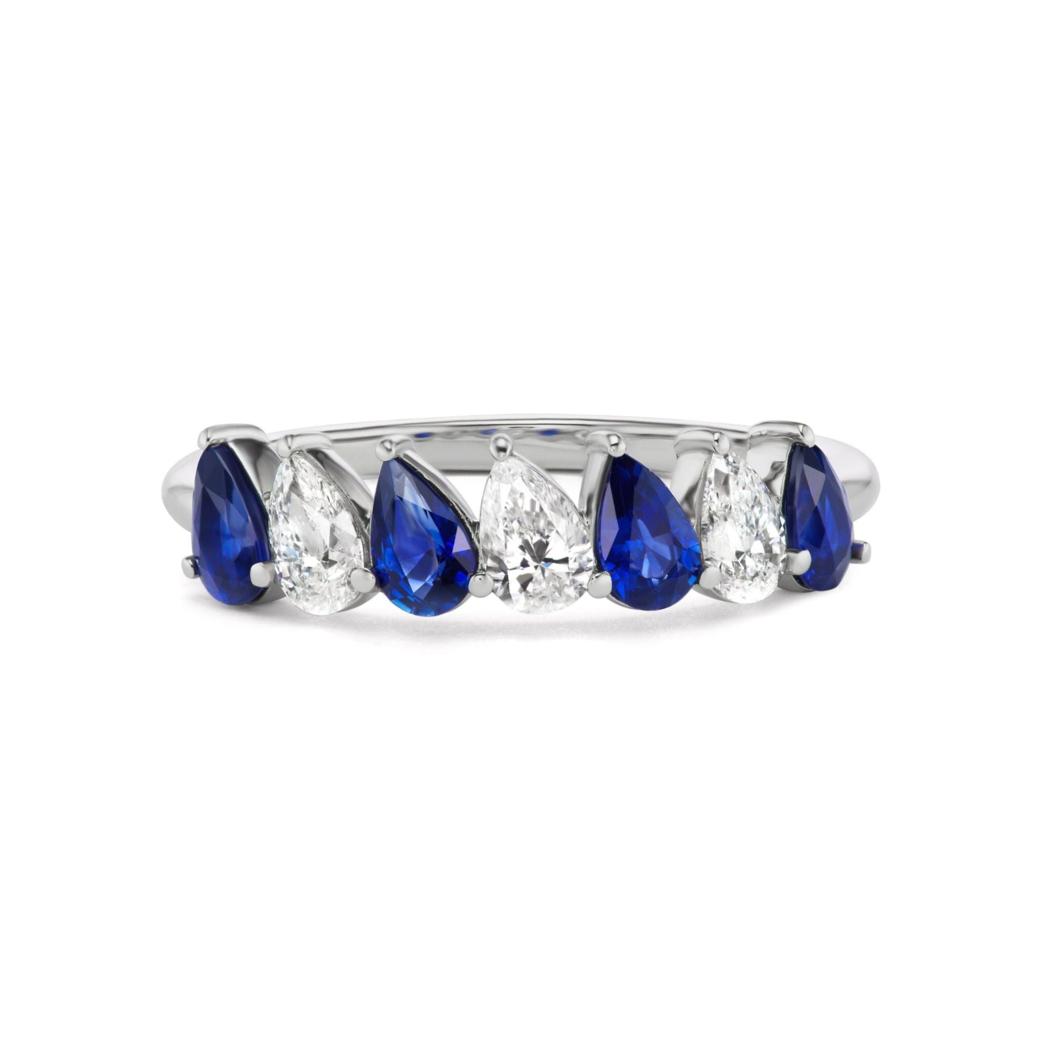 Introducing the Diagonal Pear Eternity Band with Alternating Diamonds and Pears: a stunning silver ring featuring a graceful row of alternating blue sapphire and clear pear-shaped diamonds, making it an exquisite choice for bridal bands or any special occasion.