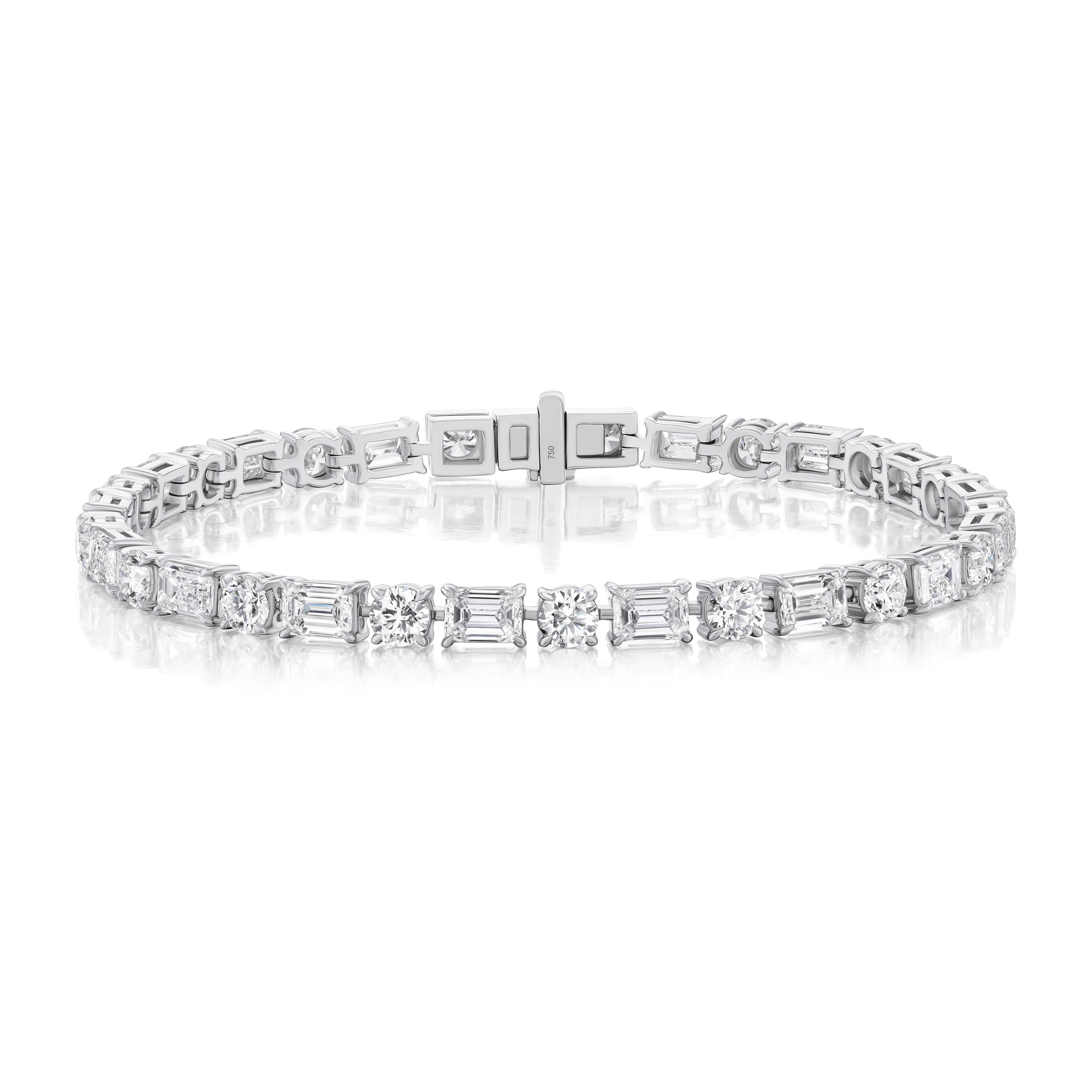 The Alternating East-West Set Round and Emerald Cut Diamond Tennis Bracelet in White Gold is shown against a white background.