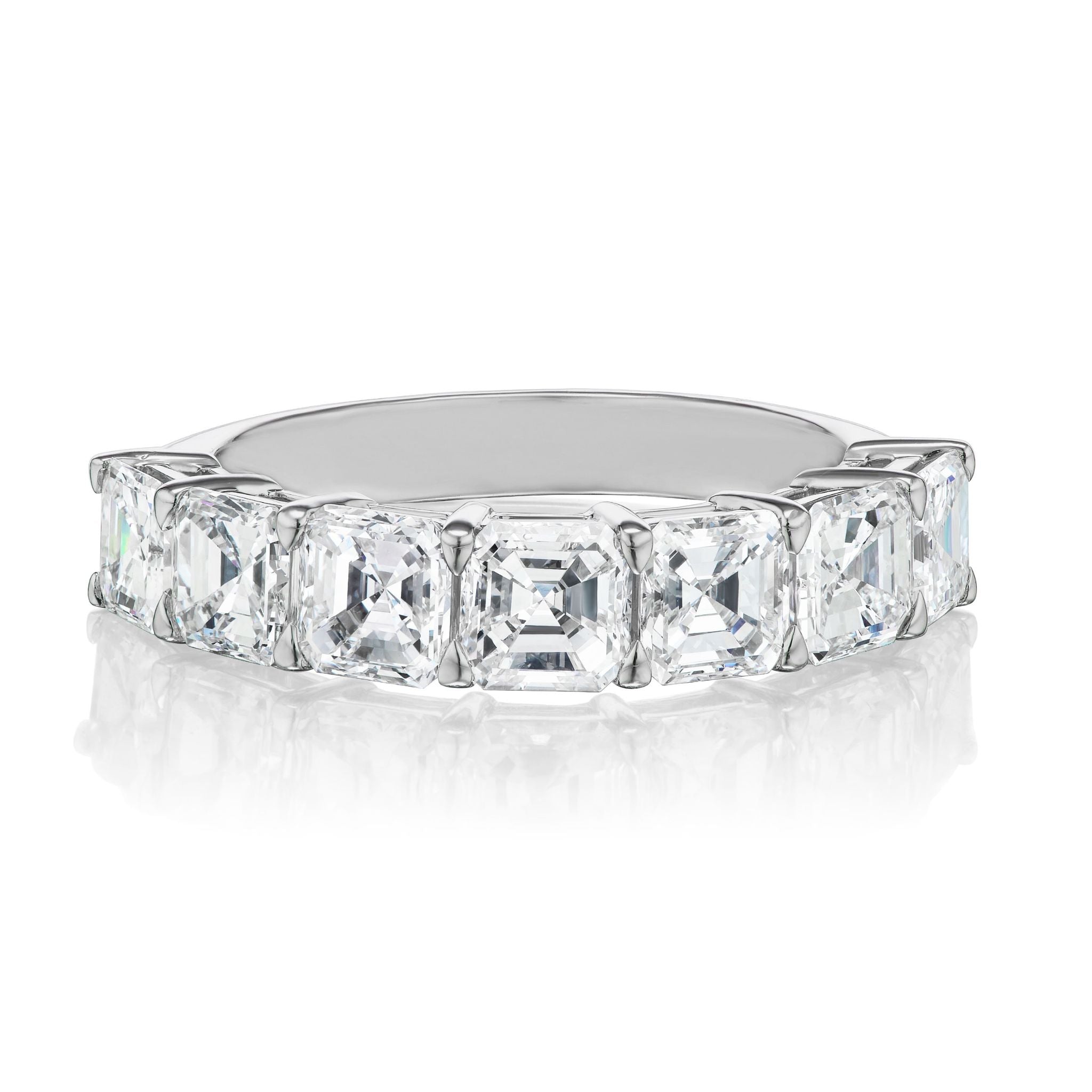 The Asscher Cut Diamond Half Eternity Band features large, clear Asscher cut diamonds set in platinum and 18k white gold, forming a striking half eternity design that beautifully reflects light.