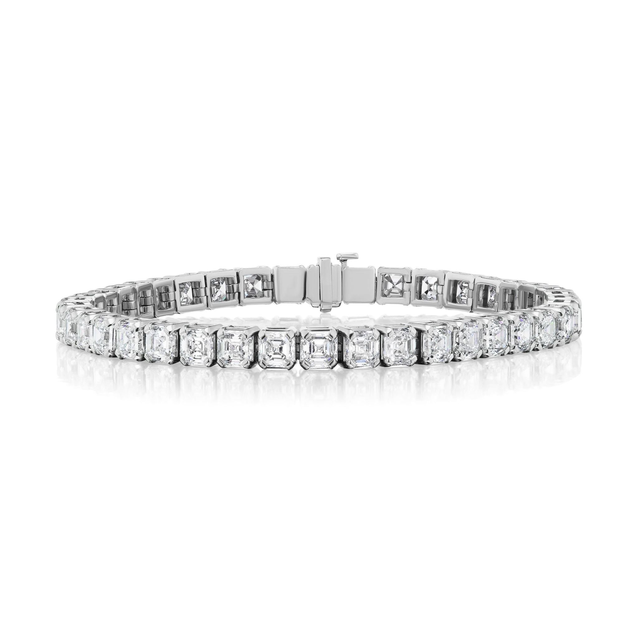 A captivating Tab Set Asscher Cut Diamond Tennis Bracelet in white gold, elegantly showcasing a continuous line of high-clarity VVS-VS Asscher cut diamonds against a pristine white background.