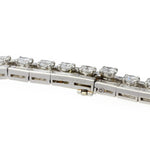 A close-up of the Cartier Mid-Century Diamond Bracelet, featuring round-cut clear gemstones in prong settings with a box clasp and safety latch, inspired by vintage designs. The background is white.