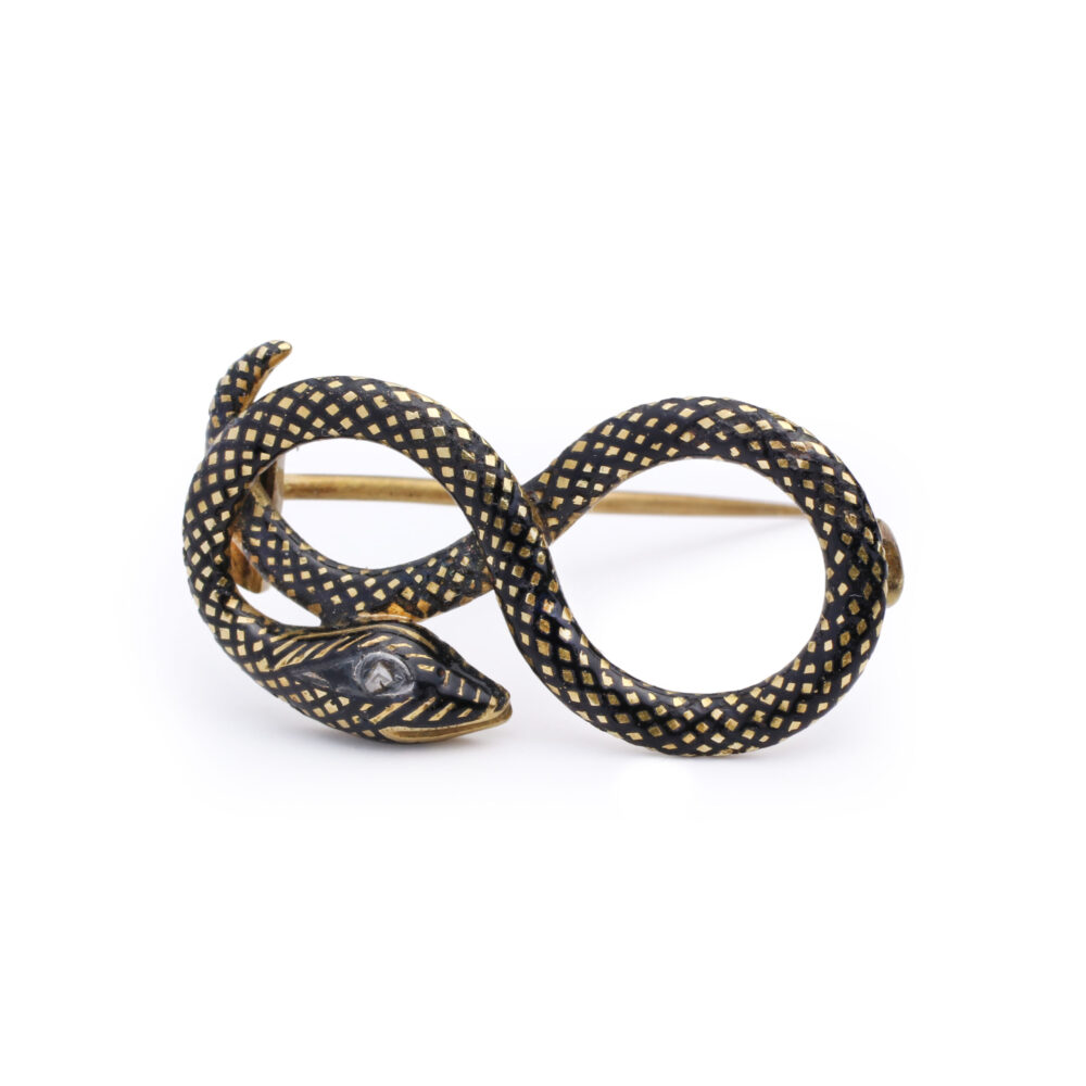 The Antique Diamond and Enamel Snake Pin features a gold and black entangled snake in an infinity shape with a checkered enamel pattern, adorned with diamonds, and a pin backing.