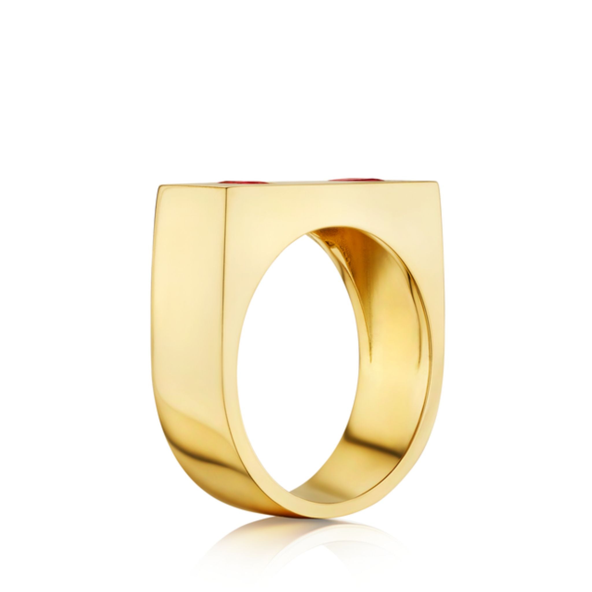 The Mixed Shape Ruby Bar Ring in Yellow Gold features a wide, flat, polished bar top with two small pear-cut rubies adding vibrant red accents. Photographed on a white background, its modern style is highlighted by the smooth yellow gold finish.