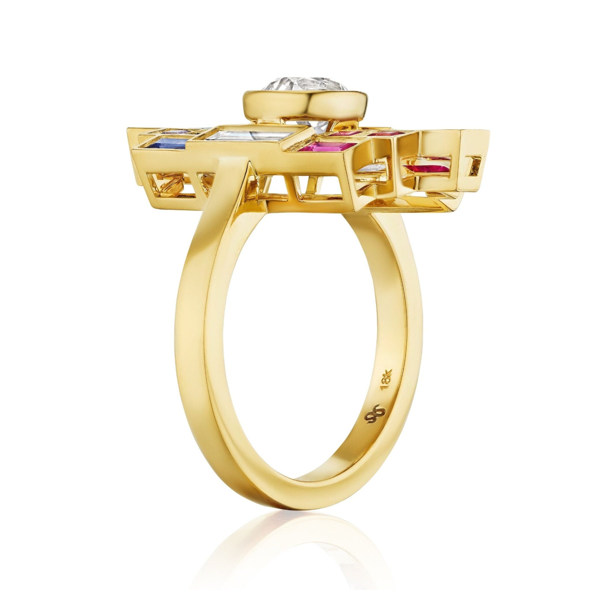 The Art Deco Bezel Set Ring in yellow gold features a geometric, elevated setting with multicolor baguette cut sapphires and a central diamond, shown in a side view against a white background.