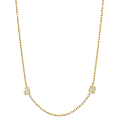 The Bespoke Bezel Set Diamond Initial Necklace in Yellow Gold showcases two gold-framed letter charms, each with sparkling diamond initials spaced along the chain—ideal for personalizing with your favorite letters.