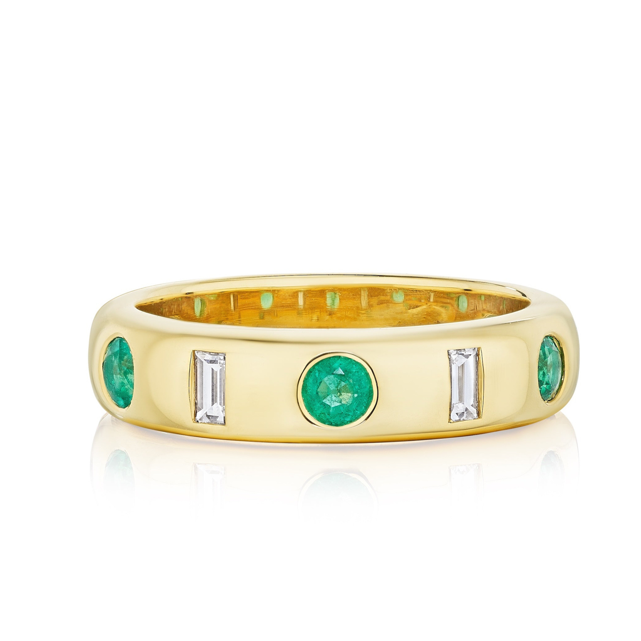 The Burnish Set Baguette Diamond and Round Emerald Band in Yellow Gold features alternating round emeralds and baguette diamonds in a sleek, polished yellow gold design.