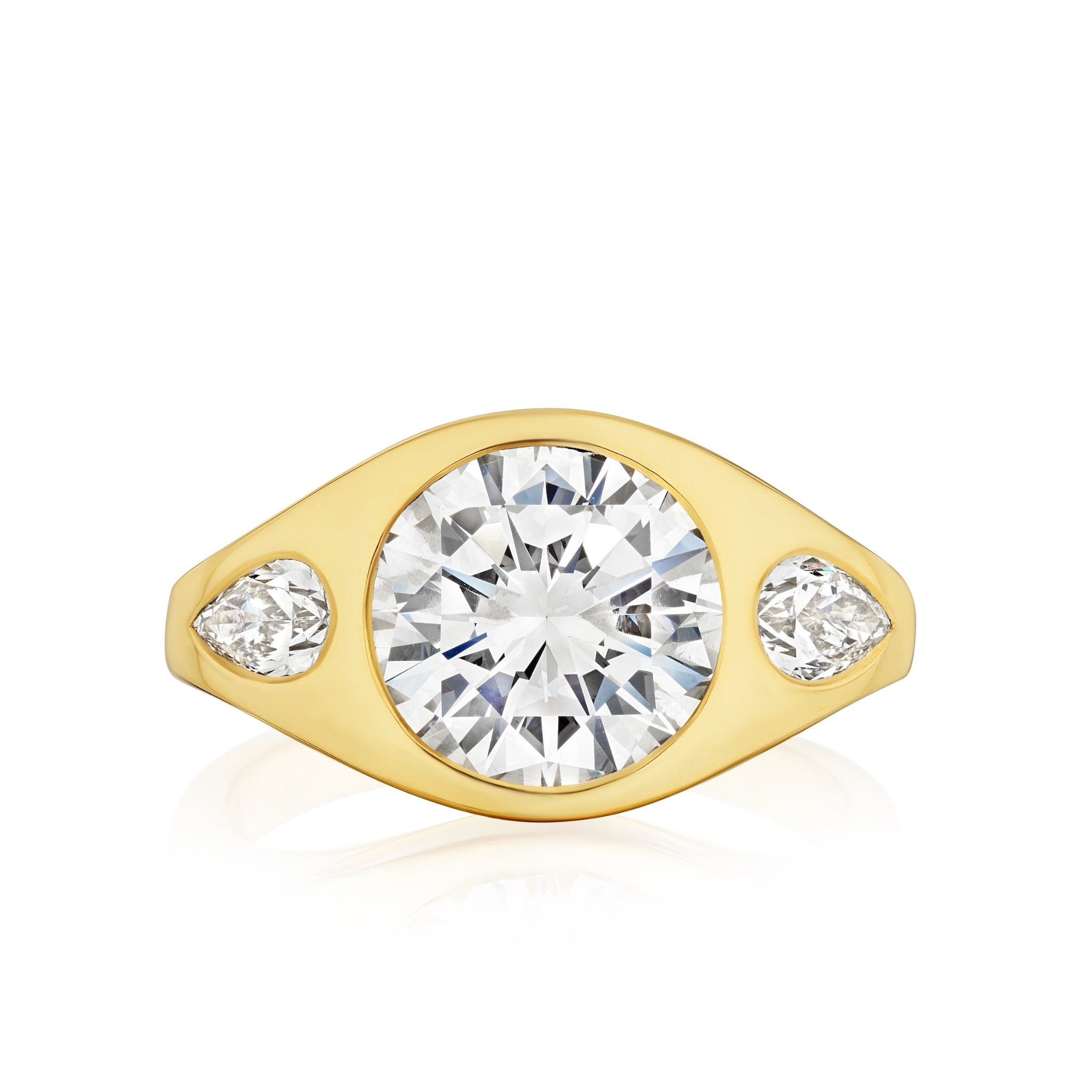The Burnish Set Gypsy Ring in yellow gold features round and pear-shaped diamonds set in a smooth, wide band. Personalize this elegant ring to suit your unique style.