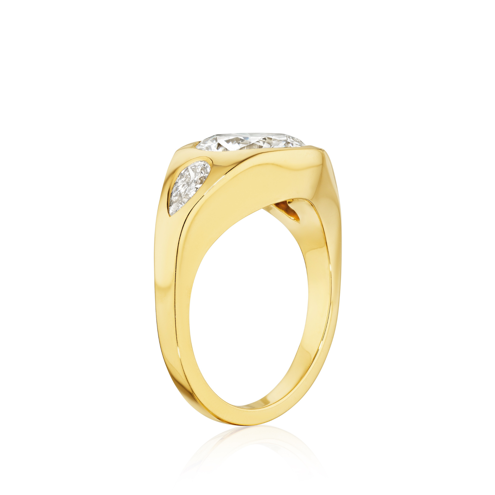 The Burnish Set Gypsy Ring in yellow gold features round and pear-shaped diamonds in a thick band, shown on a white background. Personalize this distinctive diamond ring to match your individual style.