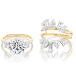 The Confetti Diamond Ring Jacket in White and Yellow Gold features a customizable split shank design with assorted diamond shapes artfully set along the bands, adding a unique touch to your ring.