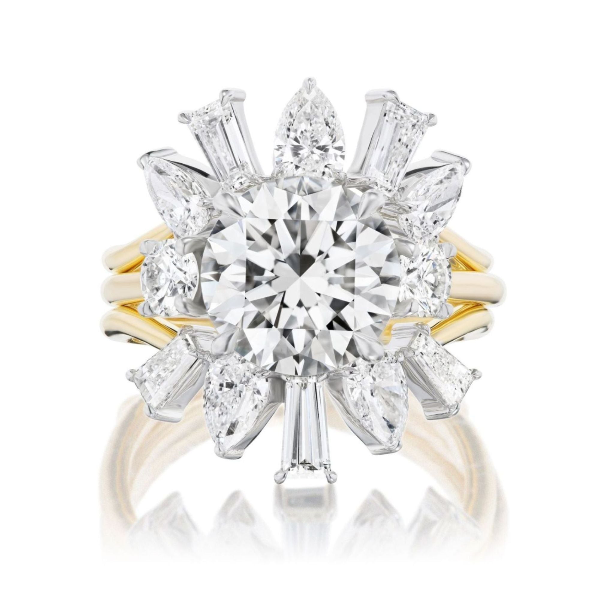 A gold ring featuring a round center diamond and starburst pattern of smaller diamonds is paired with the Confetti Diamond Ring Jacket in white and yellow gold for added brilliance.
