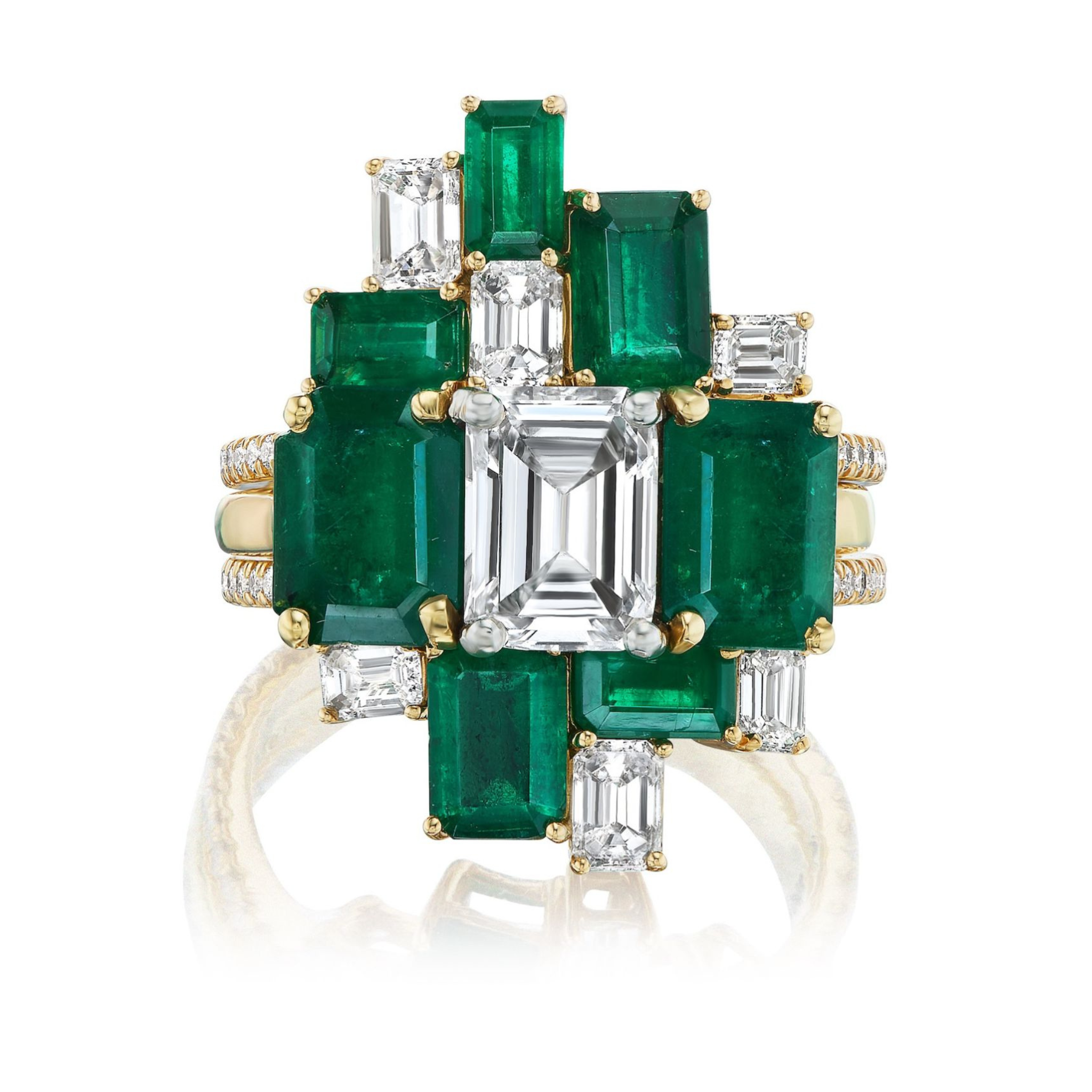 The Geometric Emerald Cut Emerald and Diamond Ring Jacket in Yellow Gold features a cluster of emeralds and diamonds in an intricate design, with a pavé diamond band for added sparkle.