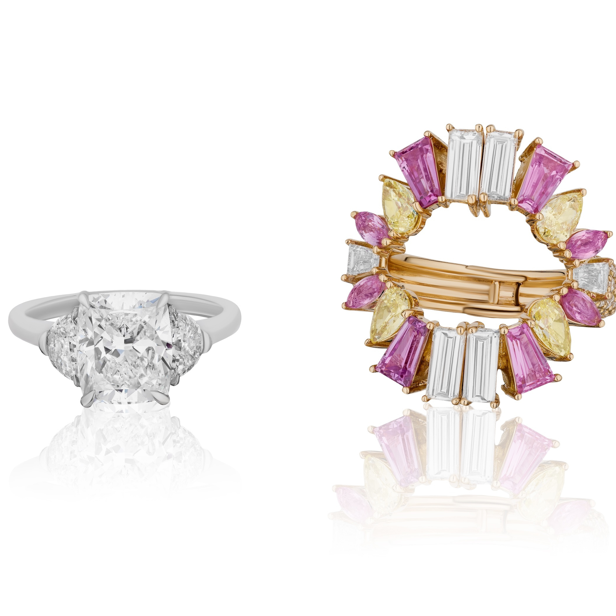 A white gold ring with a large central diamond and two baguette diamonds sits beside a Mixed Shape Diamond, Yellow Diamond, and Pink Sapphire Ring Jacket in Rose Gold.