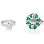 Two rings side by side: one with a single round diamond on a plain band, and the other, the Mixed Shape Emerald and Diamond Ring Jacket in White Gold, featuring emeralds and diamonds in a floral or wreath-like design.