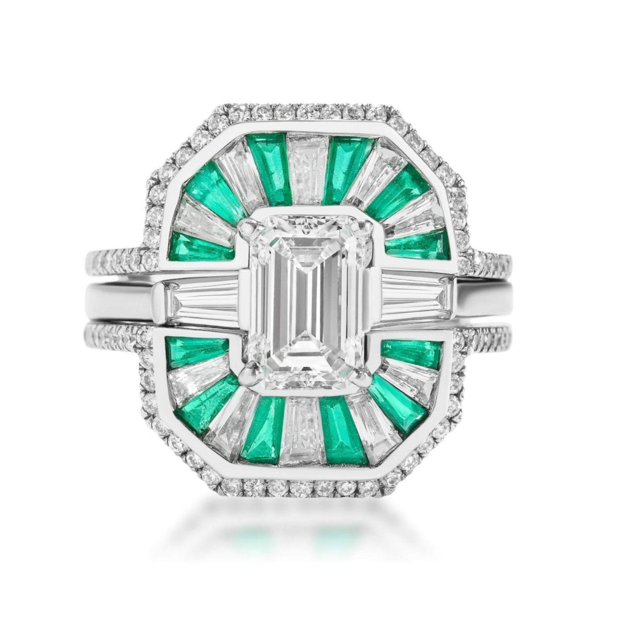 The Mosaic Tapered Baguette Emerald and Diamond Ring Jacket in White Gold features emerald and diamond segments with a pavé diamond band, offering a geometric design with alternating baguette diamonds and green emeralds for added brilliance.