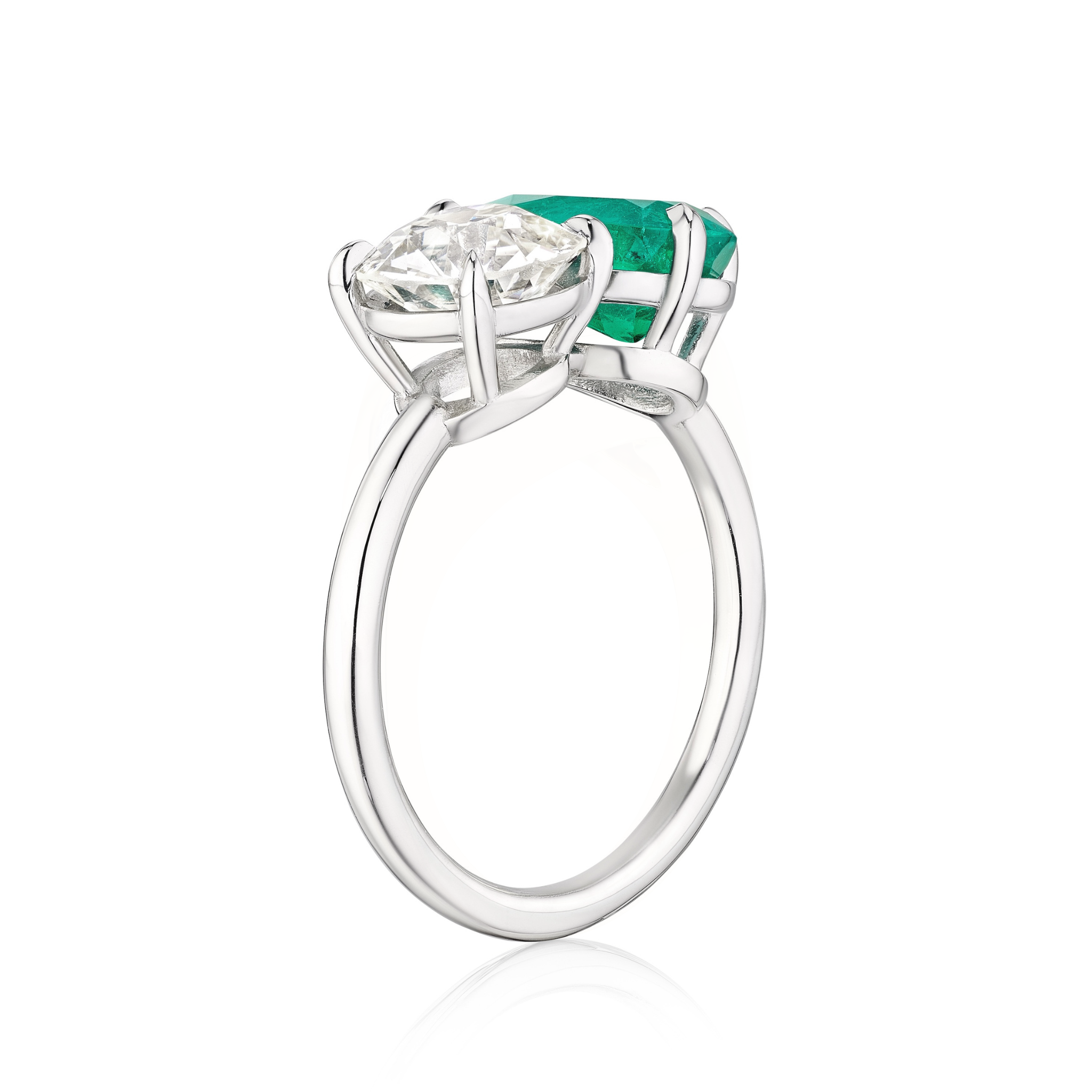 The Bespoke Toi et Moi Pear Shape Emerald and Round Diamond Engagement Ring in White Gold showcases a pear emerald and round diamond set side by side in claw prongs, displayed on a white background.