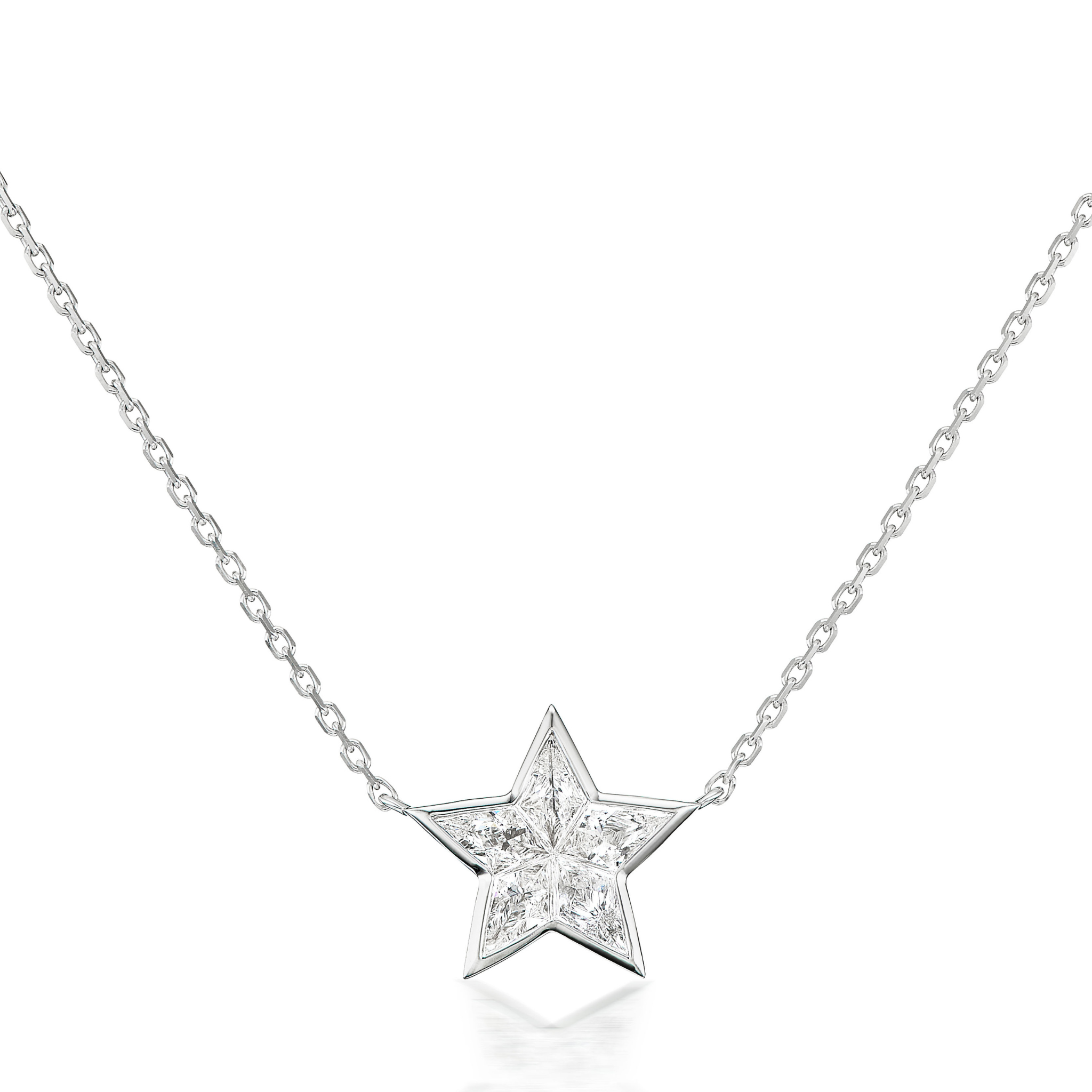 The Bezel Set Diamond Star Pendant is a delicate silver necklace with a star-shaped bezel setting and kite-shaped diamonds, showcased on a simple chain against a white background.
