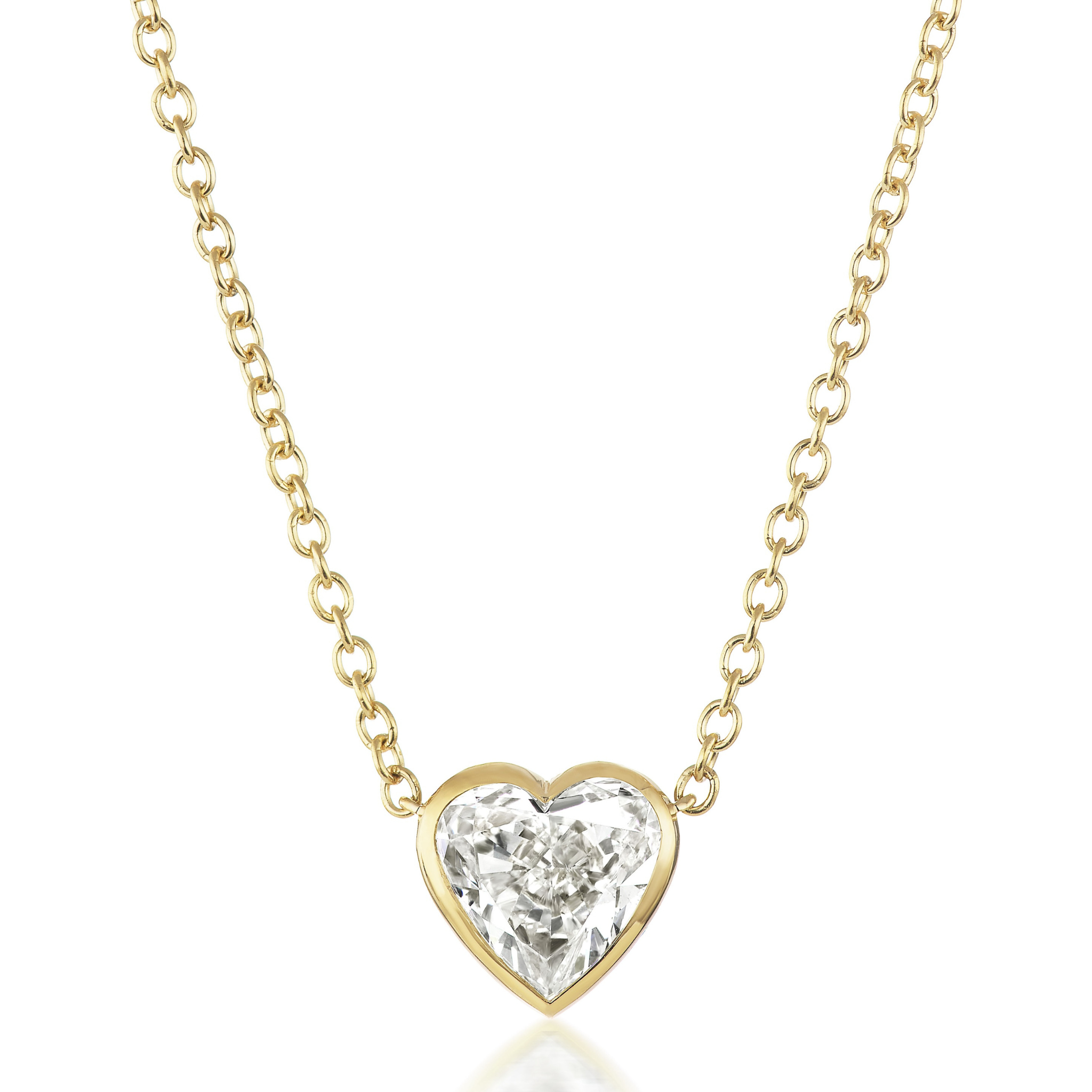 The Bezel Set Heart Shape Diamond Pendant Necklace features an 18K yellow gold chain and a heart-shaped SI2 clarity diamond in a gold bezel setting.