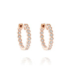 Bezel Set Hexagon Huggies with Round Brilliant Diamonds in rose gold, each segment adorned with a round white diamond, shown on a white background.