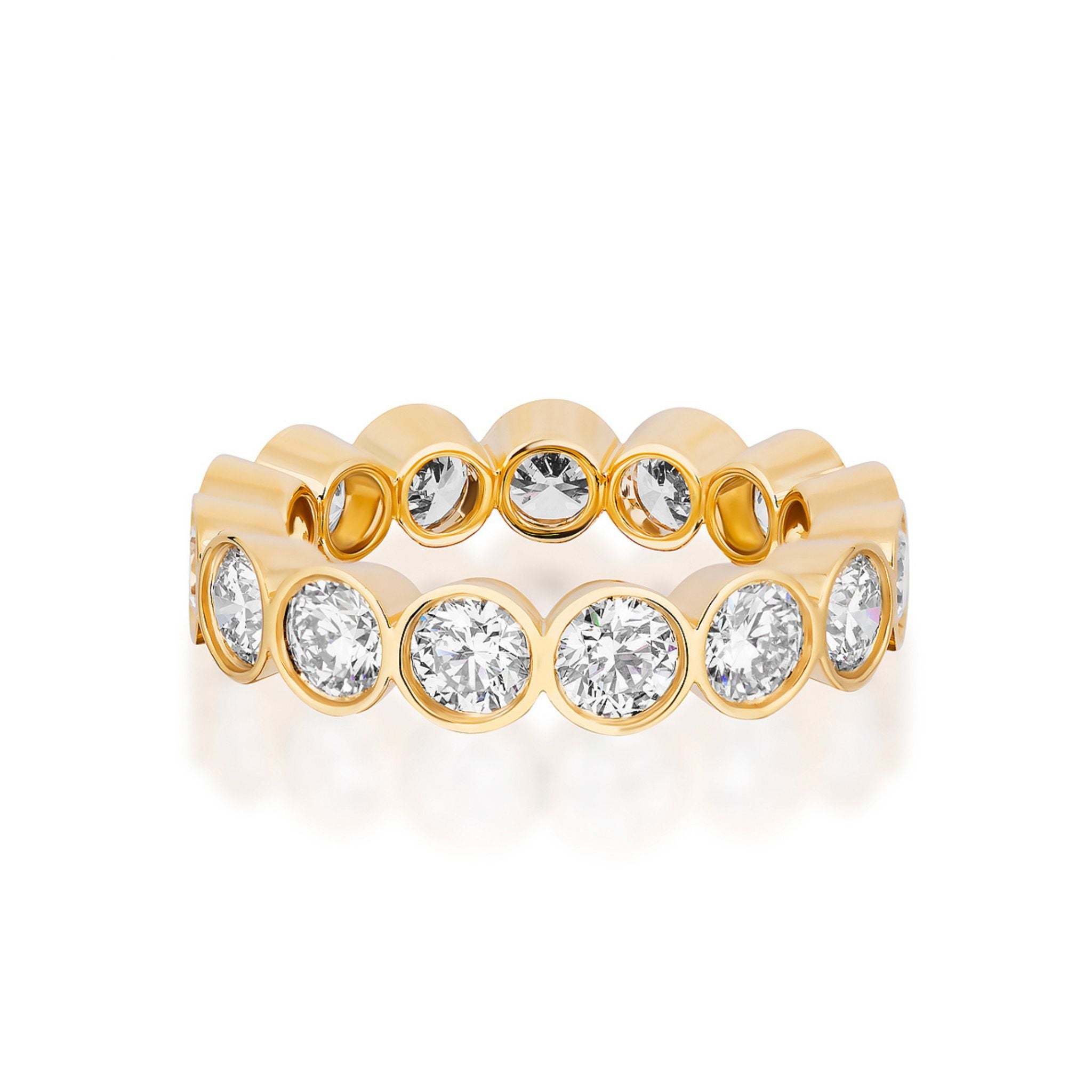 The Bezel Set Round Brilliant Diamond Eternity Band in yellow gold features round bezel-set diamonds encircling the band, ideal as an engagement or celebration ring, showcased against a white background.