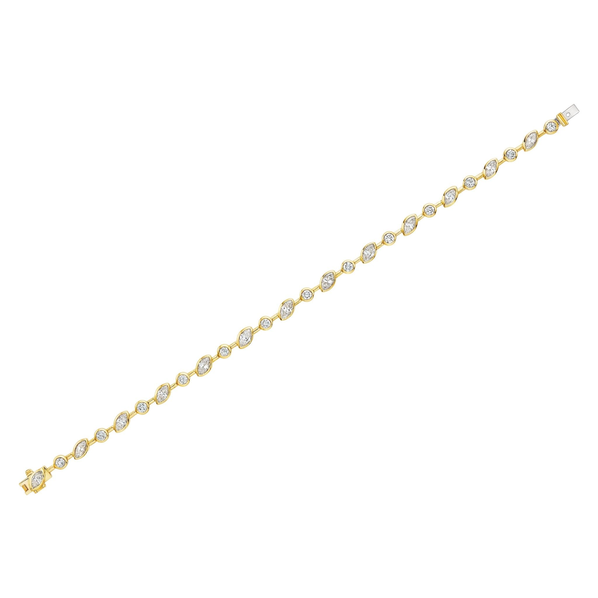 The Marquise and Round Diamond Linked Tennis Bracelet in Yellow Gold features alternating marquise and round diamonds set in yellow gold links, secured with a sturdy clasp for elegant and timeless style.
