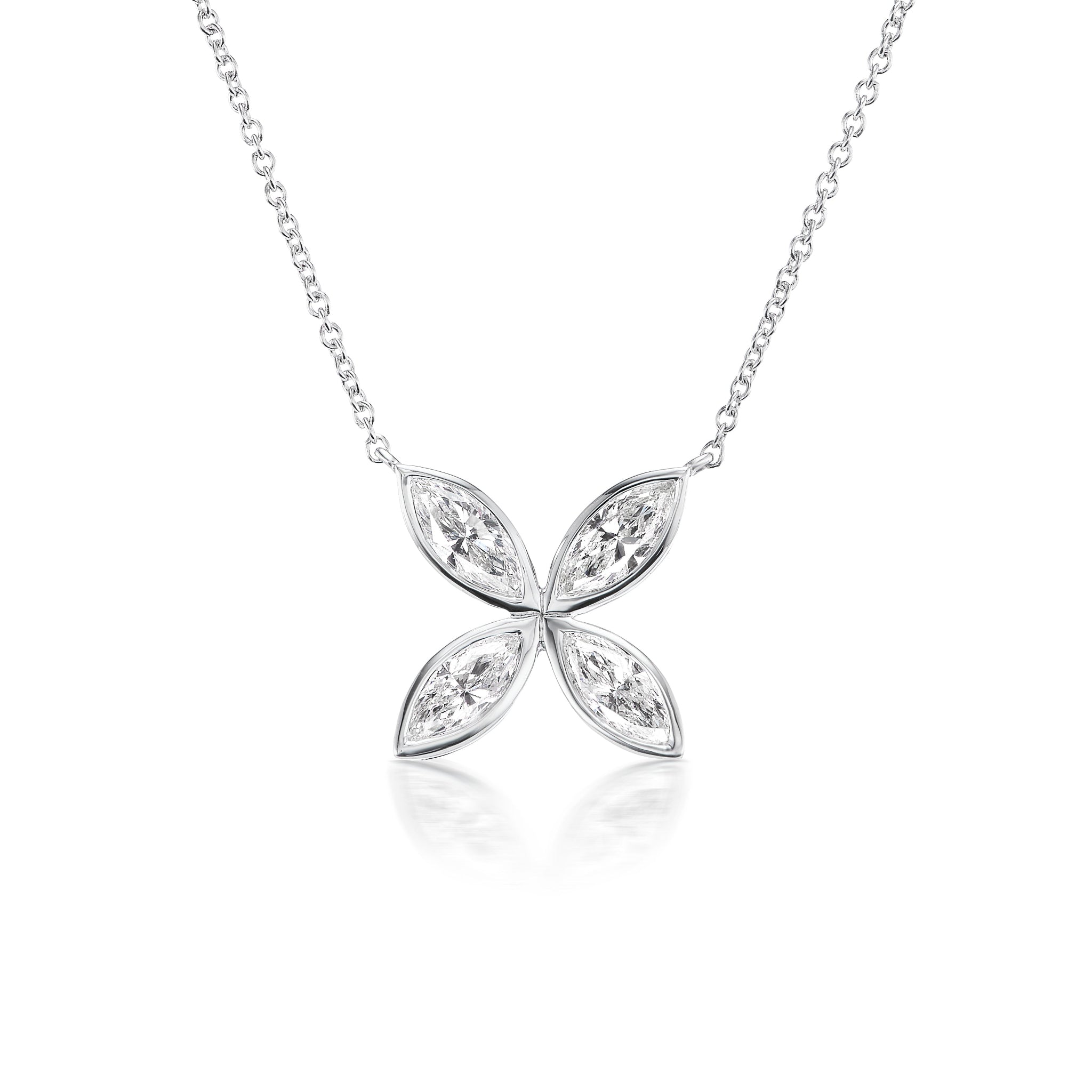 The Bezel Set Marquise Diamond Floral Pendant showcases four marquise diamonds in a symmetrical floral pattern, elegantly suspended on a delicate silver chain, displayed against a white background.
