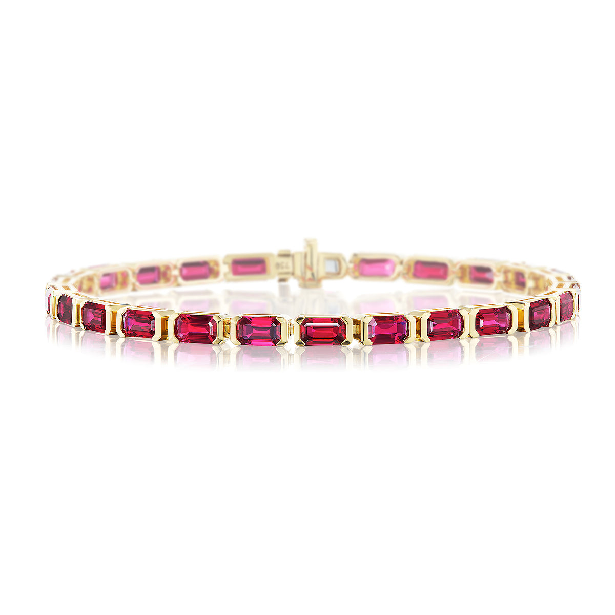 The East-West Emerald Cut Ruby Tennis Bracelet features rectangular, deep pink and red emerald cut rubies set in 18k yellow gold with prongs and a secure clasp closure.