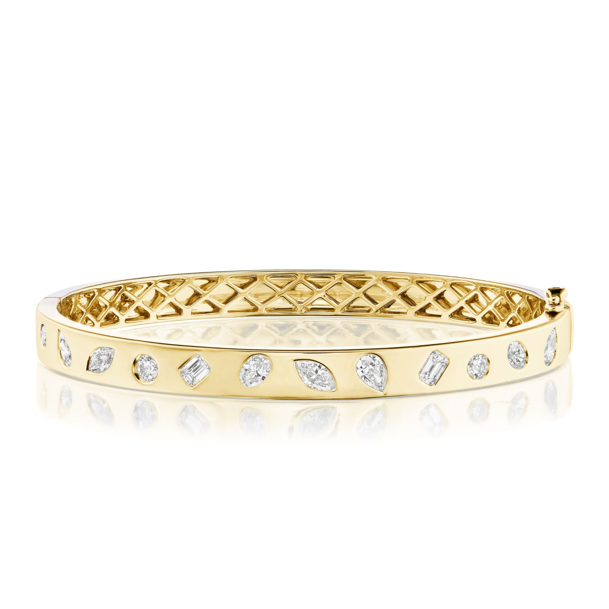 The Burnish Set Mixed Shape Diamond Bangle is crafted in 18K gold with a geometric lattice interior and features mixed shape diamonds set across its outer surface.