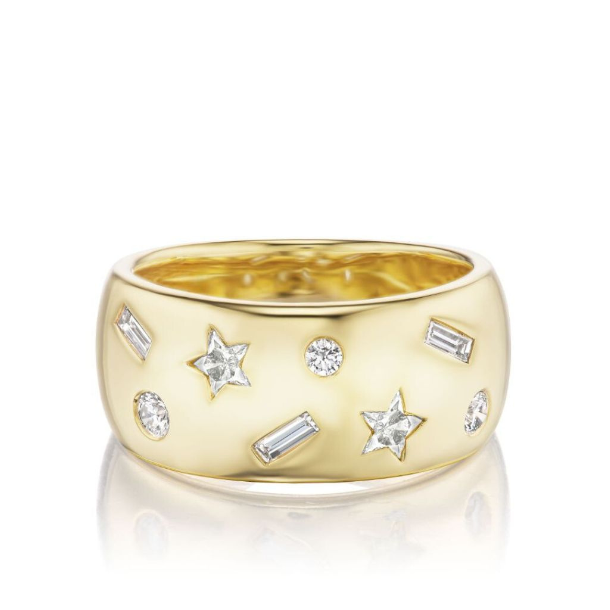 The Celestial Cigar Band in yellow gold with mixed shape diamonds is a wide 18k ring featuring star-shaped, round, and baguette diamond accents scattered across a polished surface, showcased on a white background.