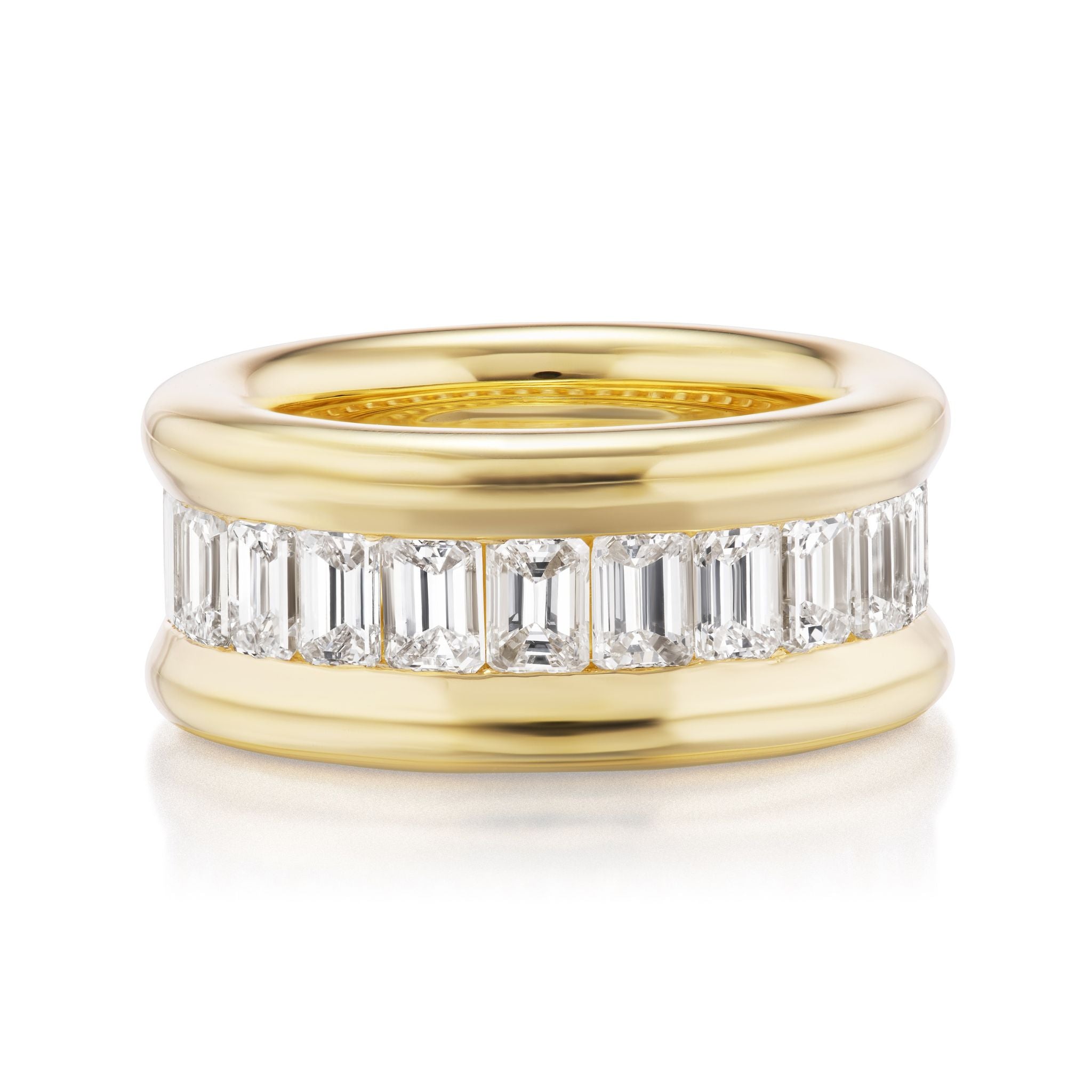 The Channel Set Emerald Cut Diamond Eternity Band in 18K yellow gold showcases a row of emerald-cut diamonds set around the band and bordered by polished edges, displayed against a white background.