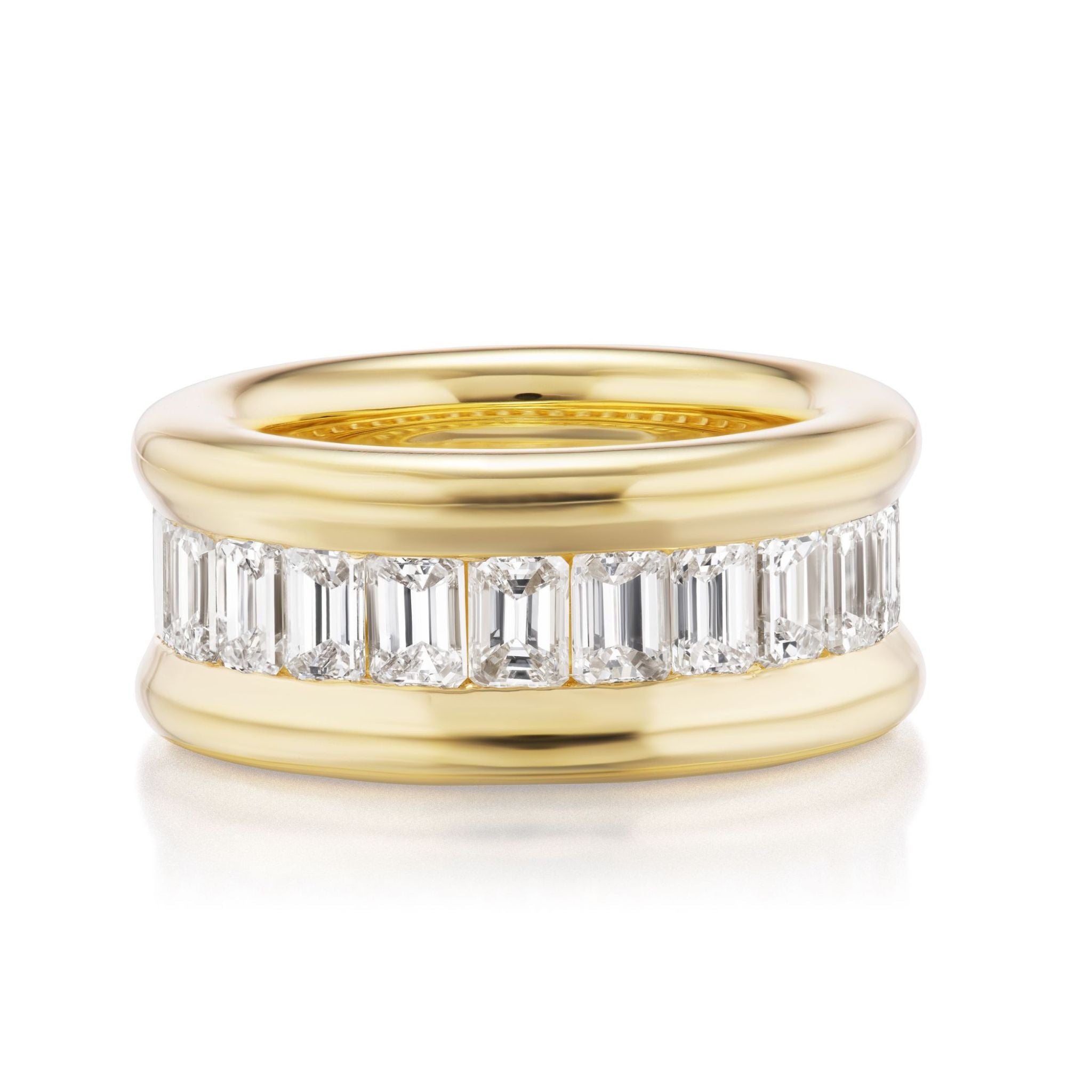 The Channel Set Emerald Cut Diamond Eternity Band features a wide 18K yellow gold band with horizontally set emerald-cut diamonds in a row, bordered by polished gold edges.