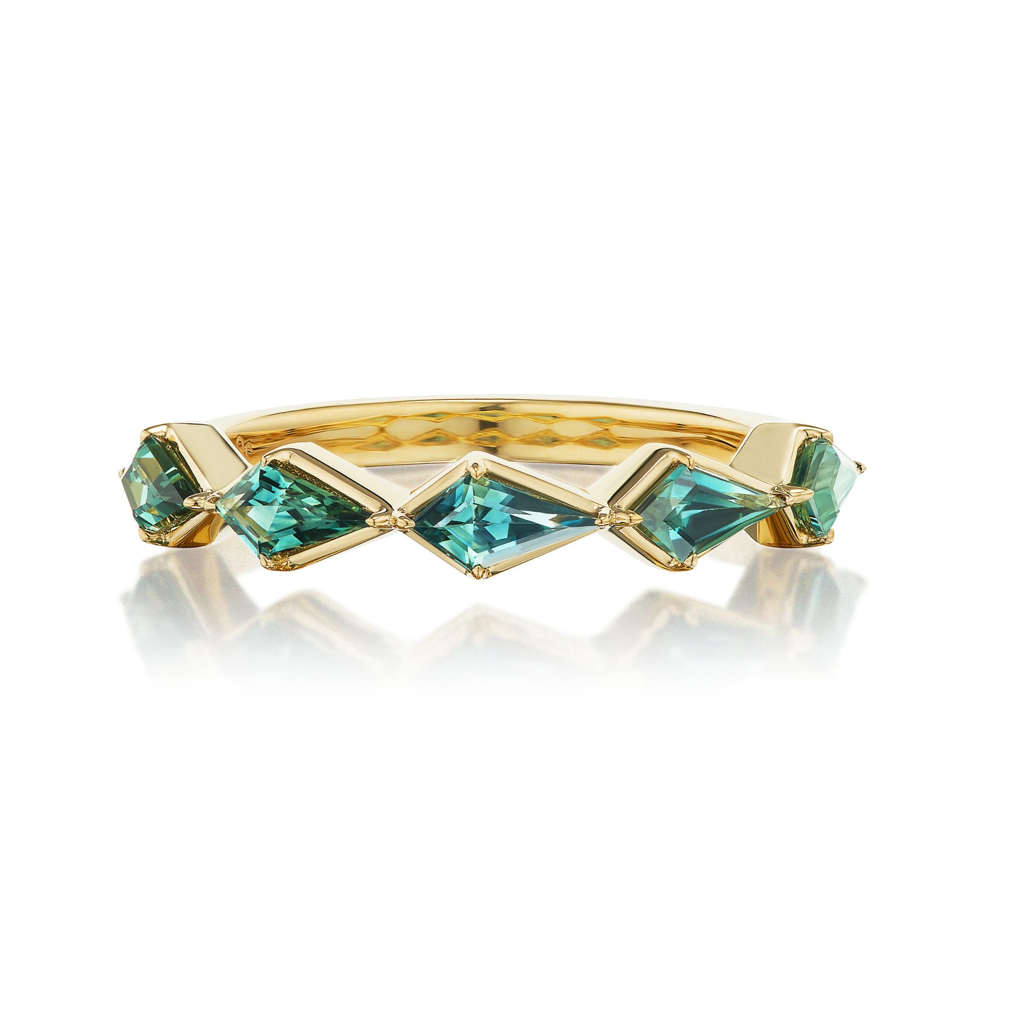 The Chasing Kites Emerald Half Eternity Band in Yellow Gold showcases a zigzag pattern of five kite-shaped emeralds in a geometric setting, displayed on a white background with a subtle reflection.