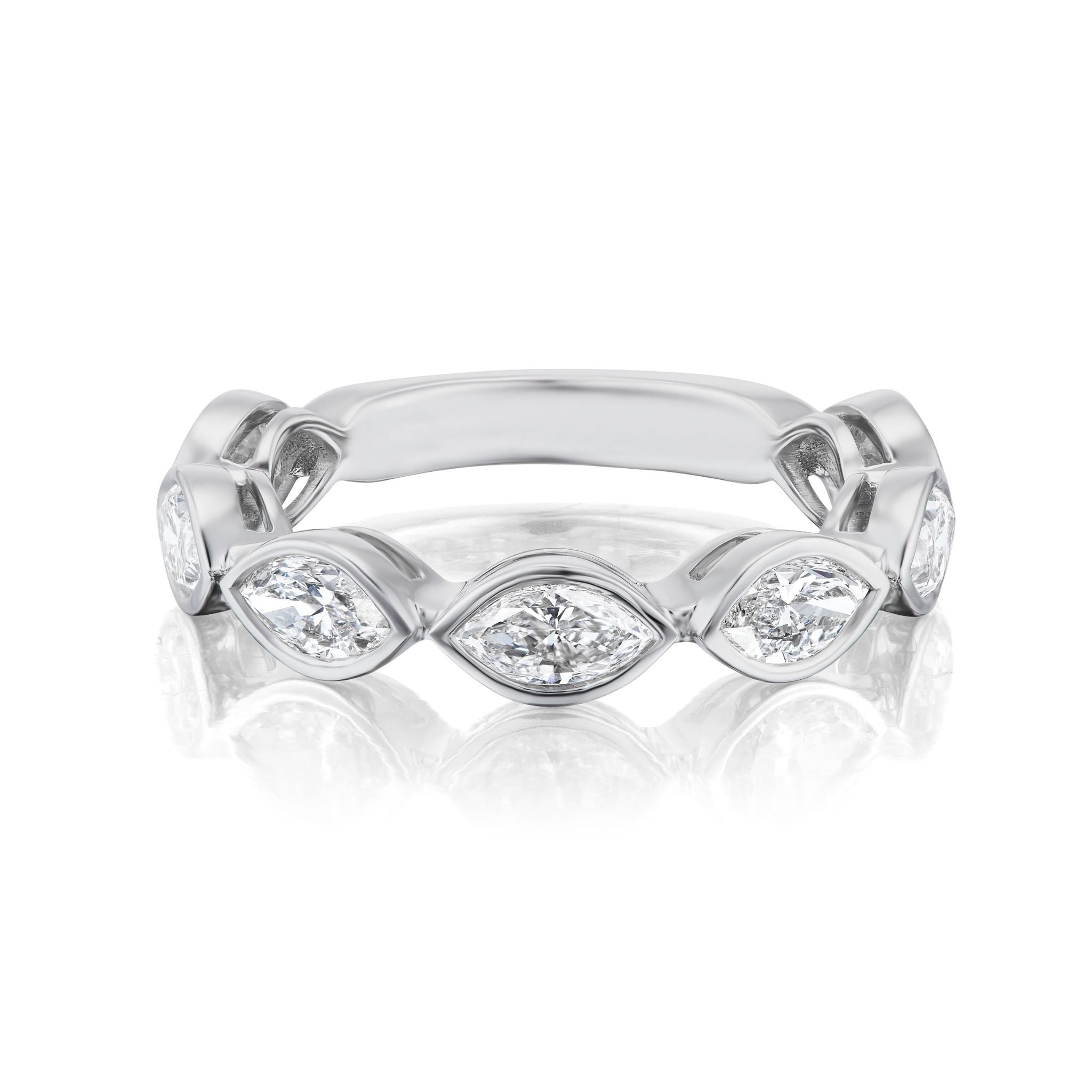 The Chasing Marquise Bezel Set Diamond Half Eternity Band features six marquise-cut diamonds in bezel settings, evenly spaced on a silver band. Shown for bridal wear on a white background with a subtle reflection below.