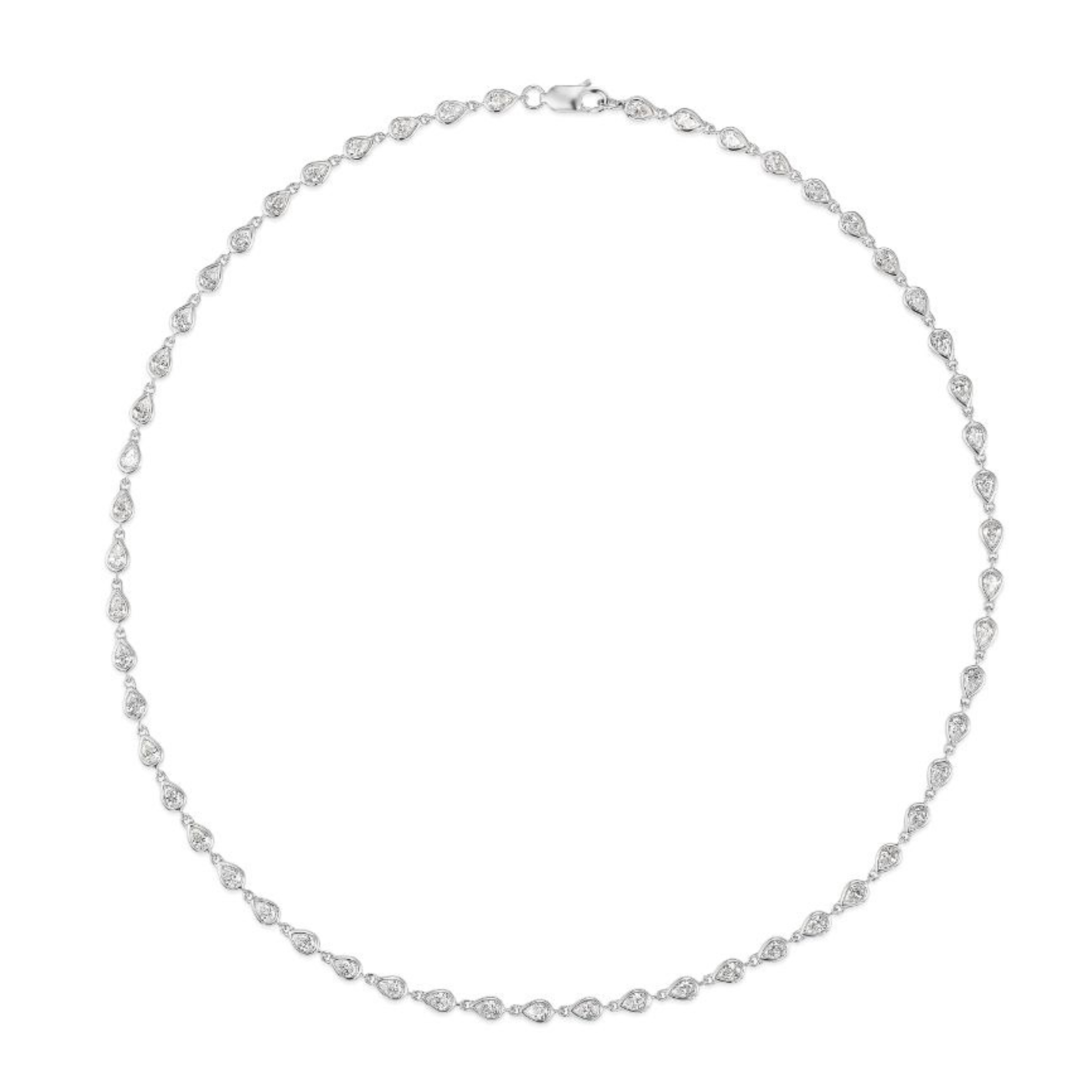 The Chasing Pears Diamond Garland Necklace showcases evenly spaced pear-shaped diamonds set in 18K gold on a thin, circular chain with a petite clasp.