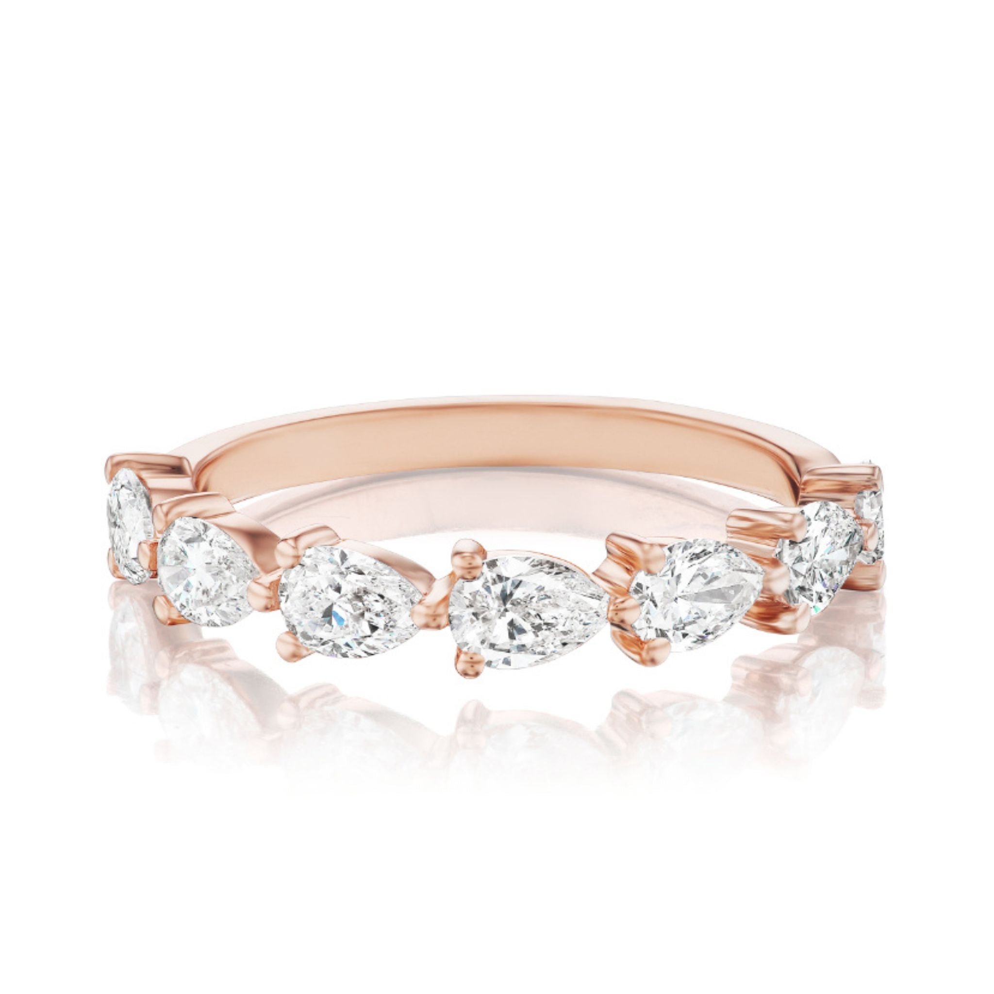 The Chasing Pears Diamond Half Eternity Band in Rose Gold features six pear-shaped diamonds, evenly spaced around the band, for an elegant bridal or celebration ring—shown on a white reflective surface.