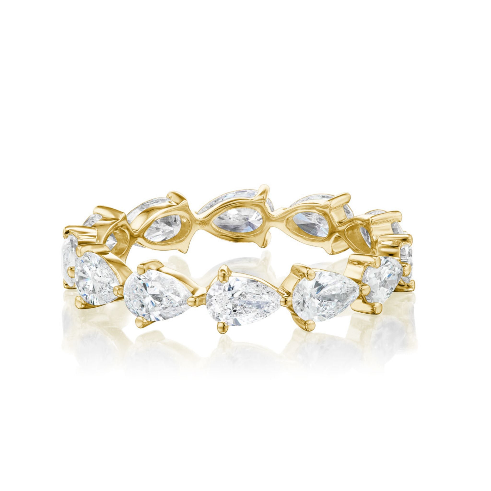 The Chasing Pears Eternity Band is a gold ring with alternating marquise and pear-shaped diamonds in claw prongs, shown on a white background.