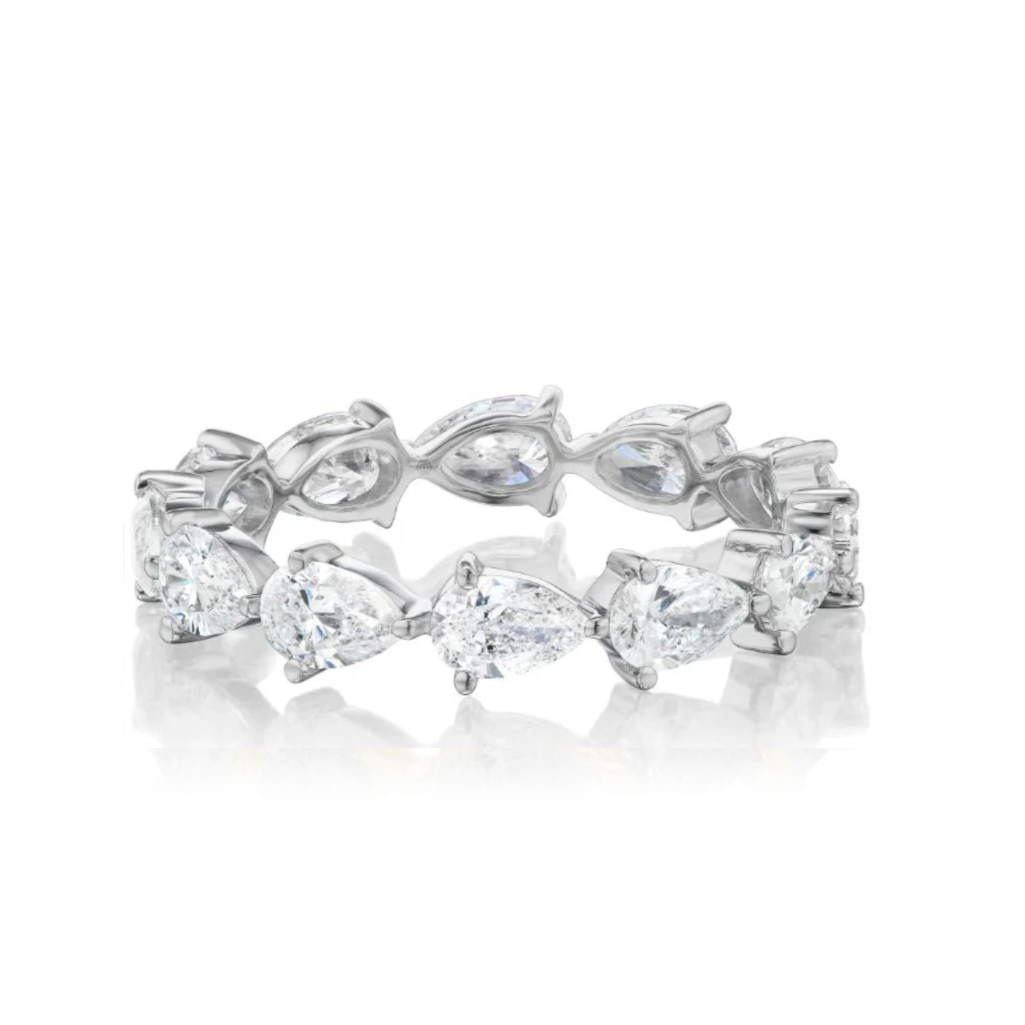 The Chasing Pears Eternity Band showcases alternating pear-shaped diamonds and marquise-cut clear stones in a continuous silver band, displayed on a white background.