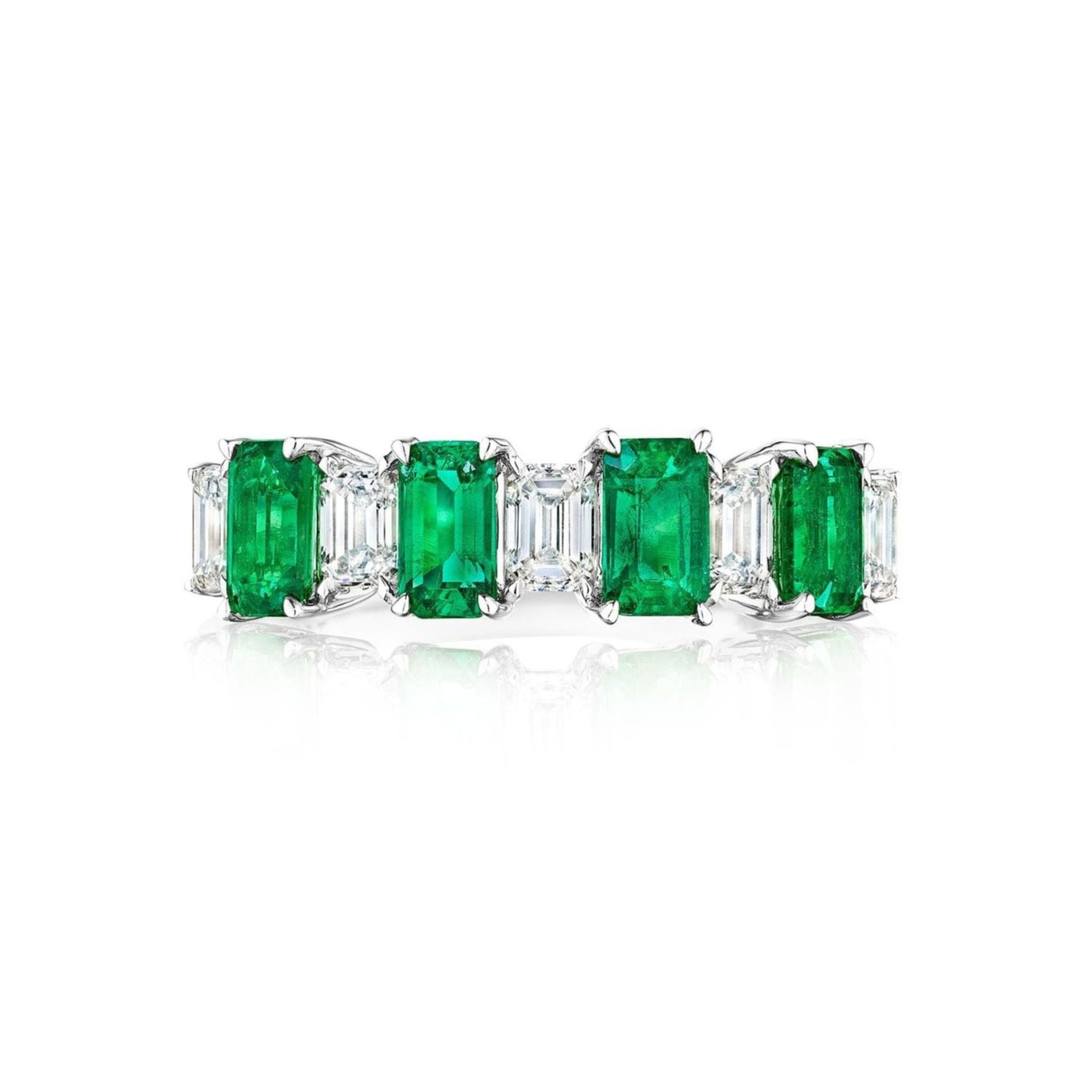 The Chroma Alternating Emerald and Diamond Half Eternity Band features emerald-cut green emeralds and white diamonds in a row on an elegant 18K gold band, displayed against a white background.