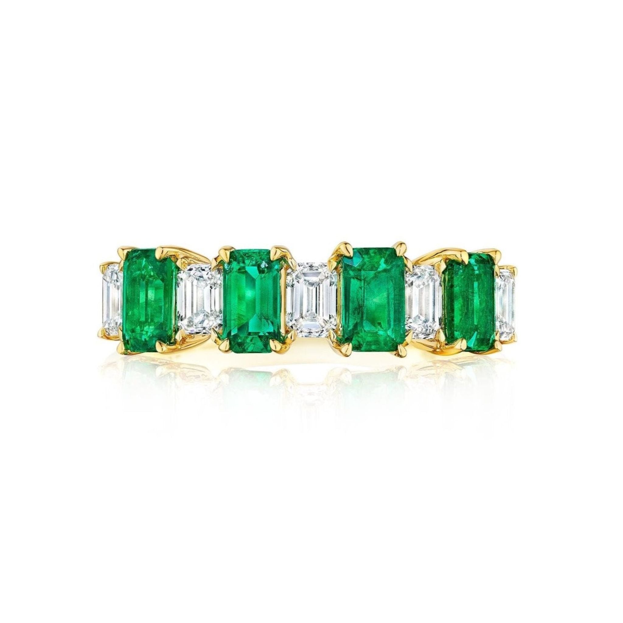 The Chroma Alternating Emerald and Diamond Half Eternity Band features alternating rectangular green emeralds and emerald cut diamonds in a single row, set in gold and shown against a white background.
