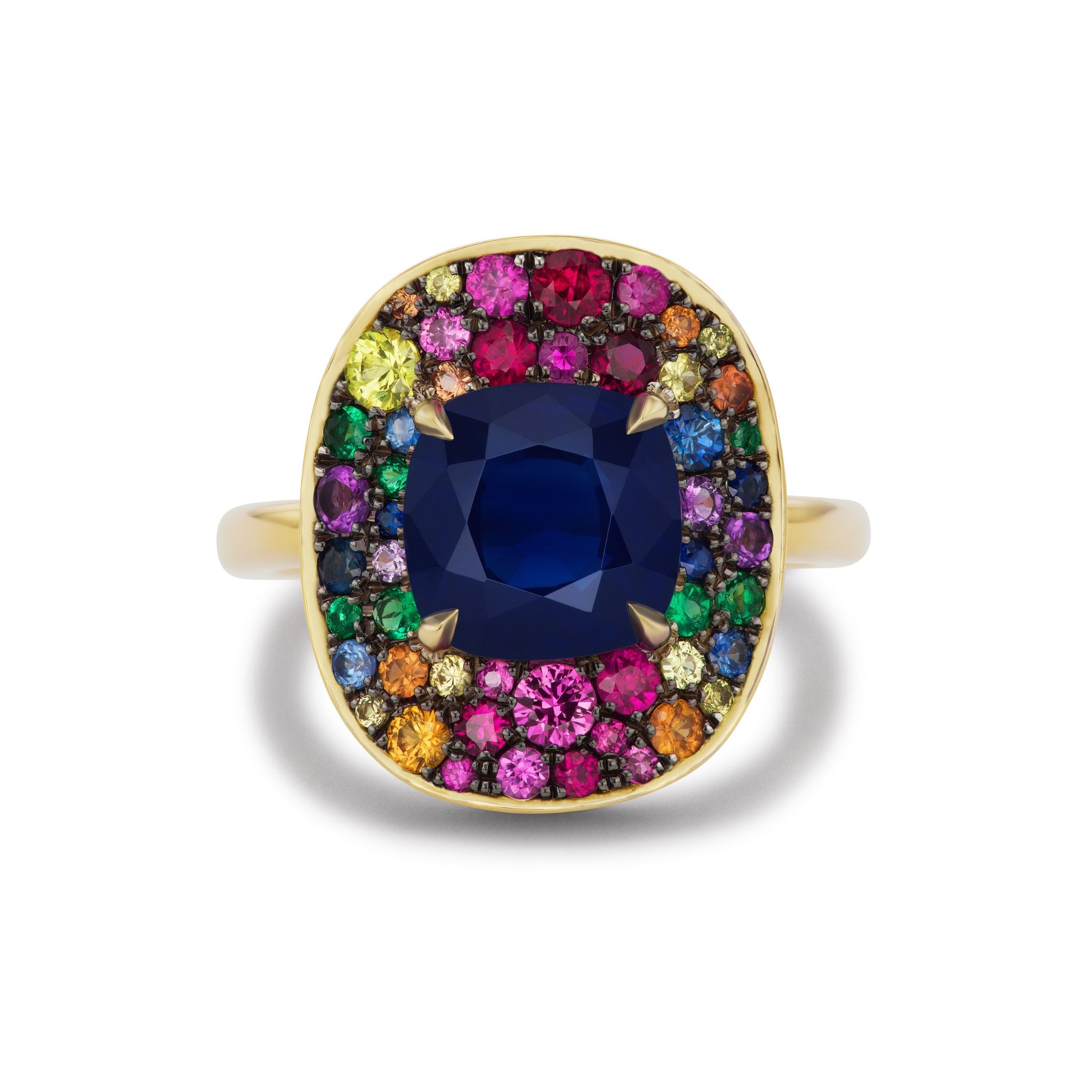 The Cobblestone Cocktail Ring features a cushion cut sapphire at the center, accented by multicolor round sapphires in an 18K yellow gold setting.
