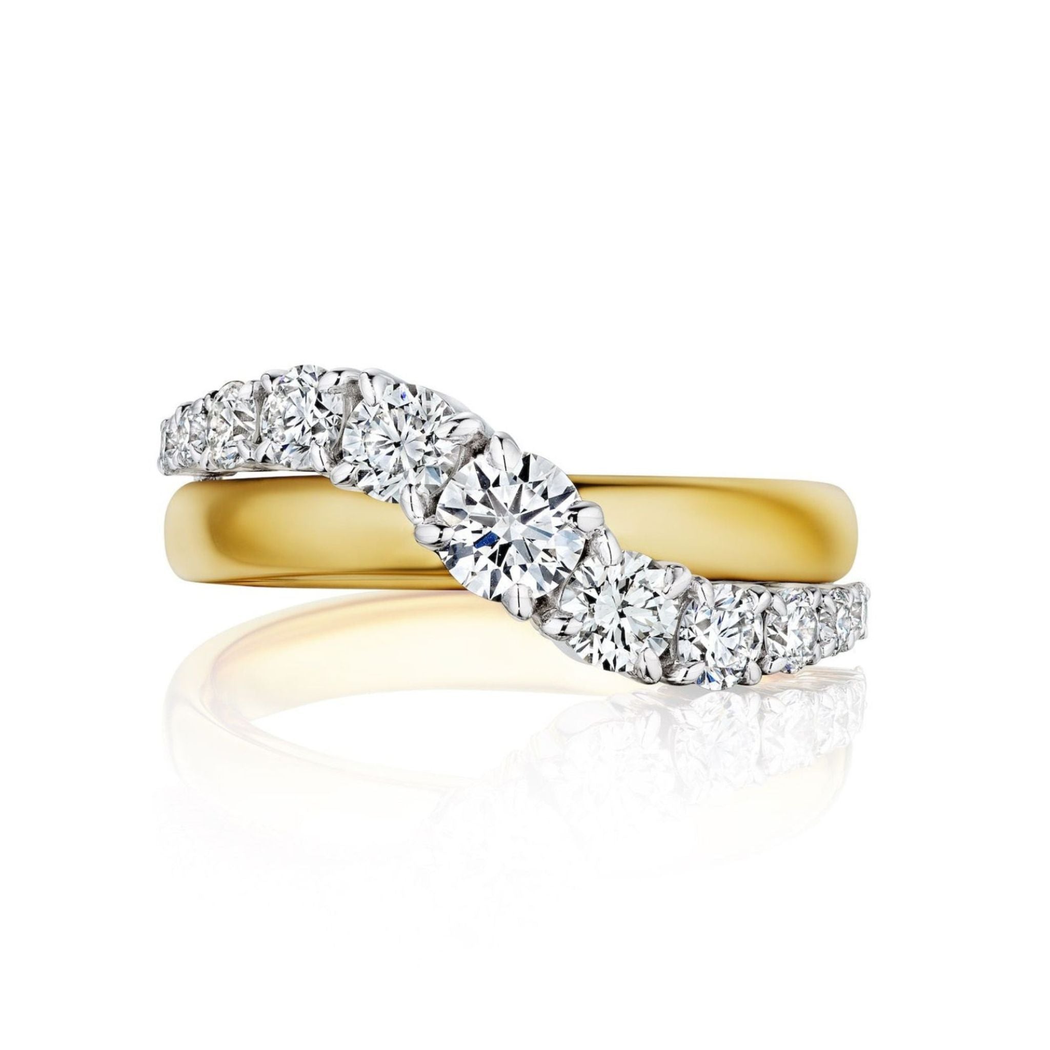The Coil Graduated Round Diamond Wave Band in Yellow Gold features a wavy row of round natural diamonds, creating an elegant design displayed on a white background.