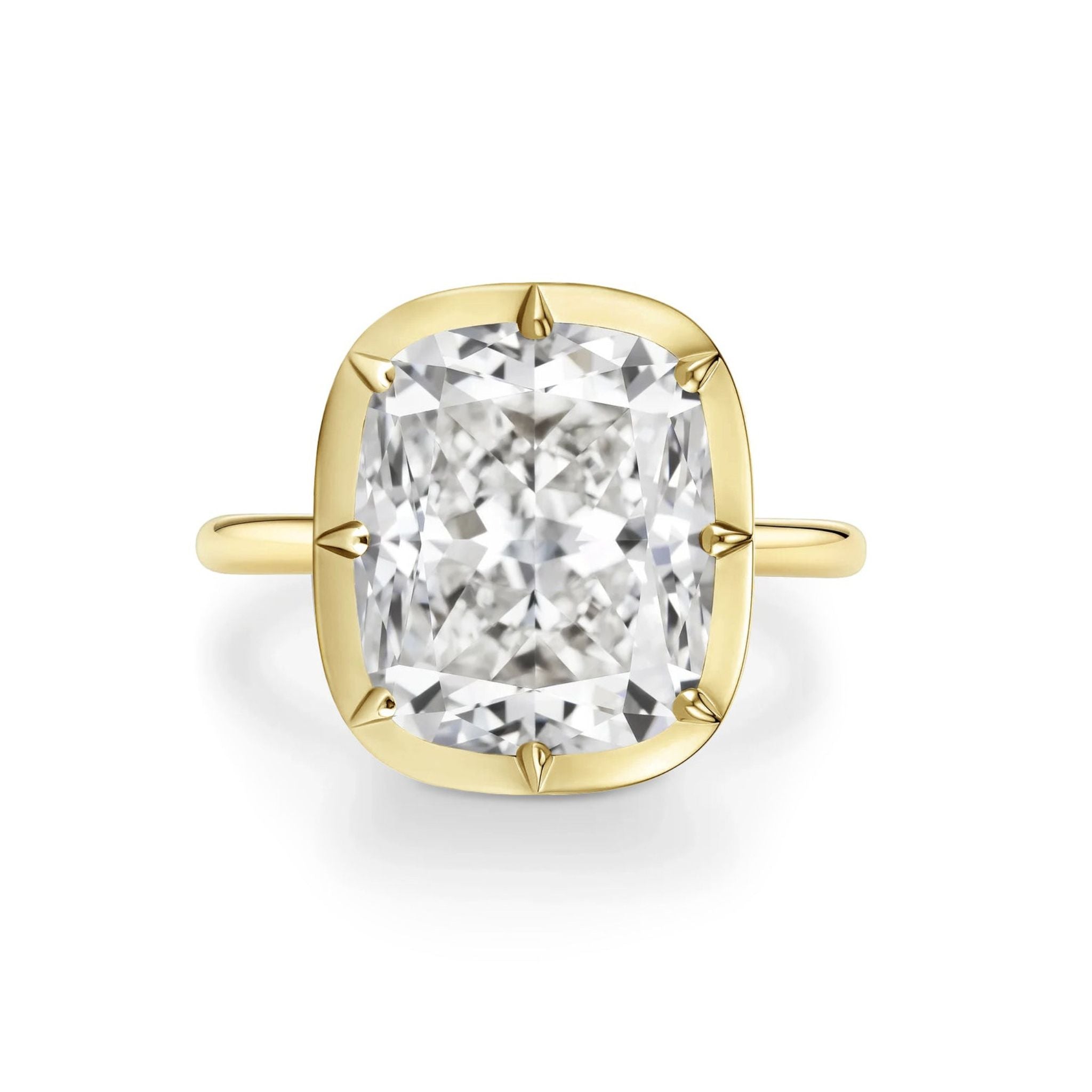 The Collet Set Cushion Cut Diamond Engagement Ring in 18k Yellow Gold is showcased against a white background.