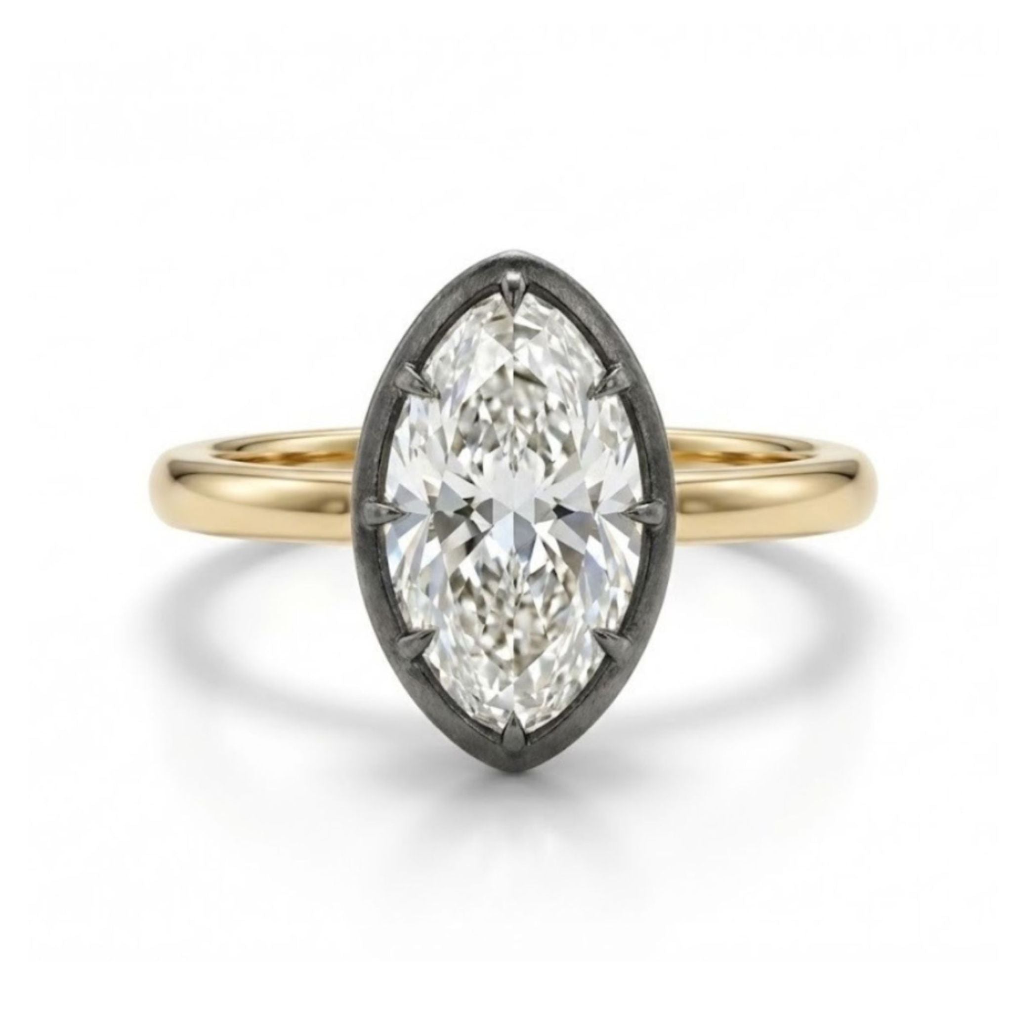 The Collet Set Marquise Diamond Solitaire Ring in Black Rhodium and Yellow Gold features a marquise diamond in a black rhodium-plated oval bezel on an 18k yellow gold band, shown on a white background.