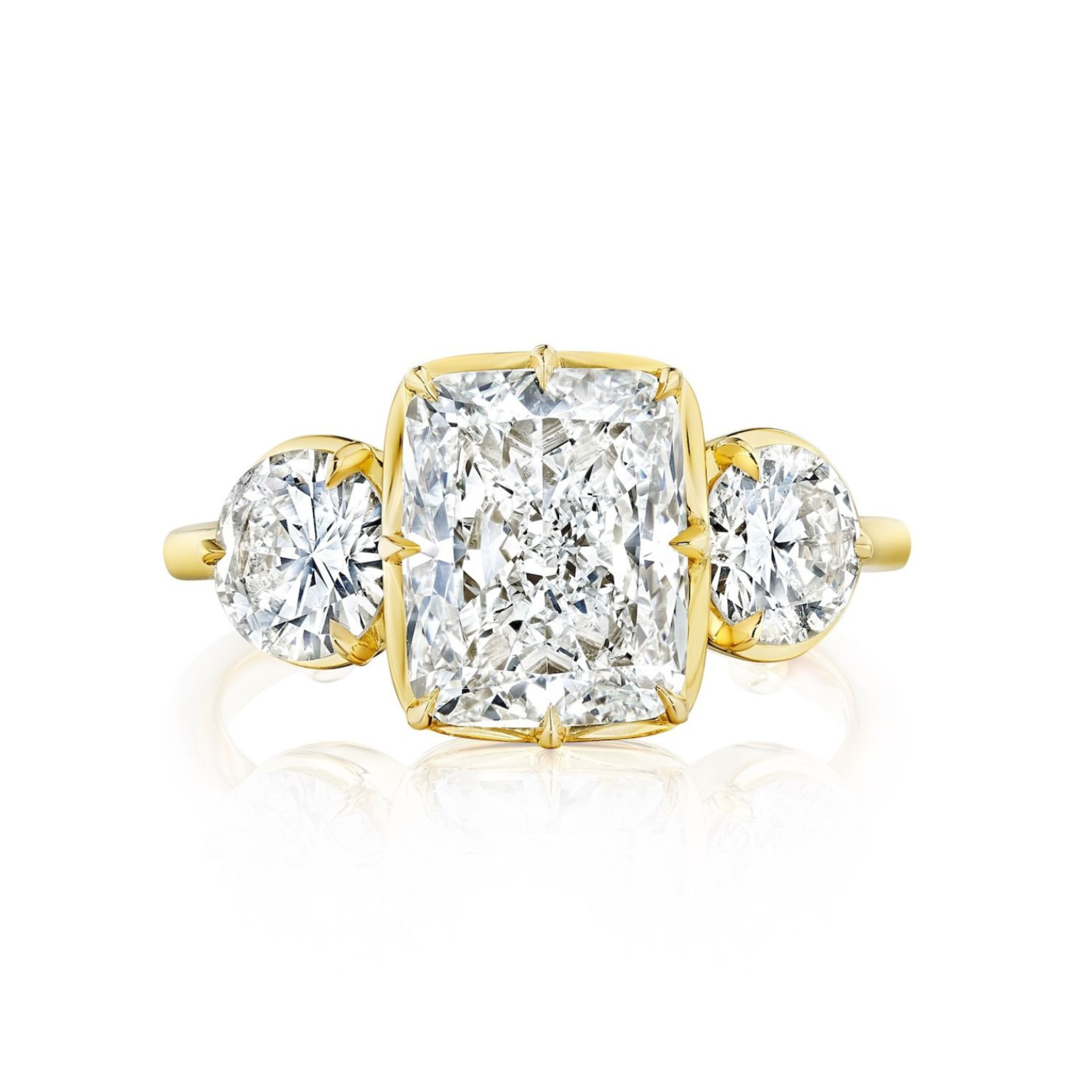 The Collet Set Cushion Cut Diamond Engagement Ring with Round Side Stones in yellow gold features a large cushion cut center diamond, elegantly accented by round diamond side stones.