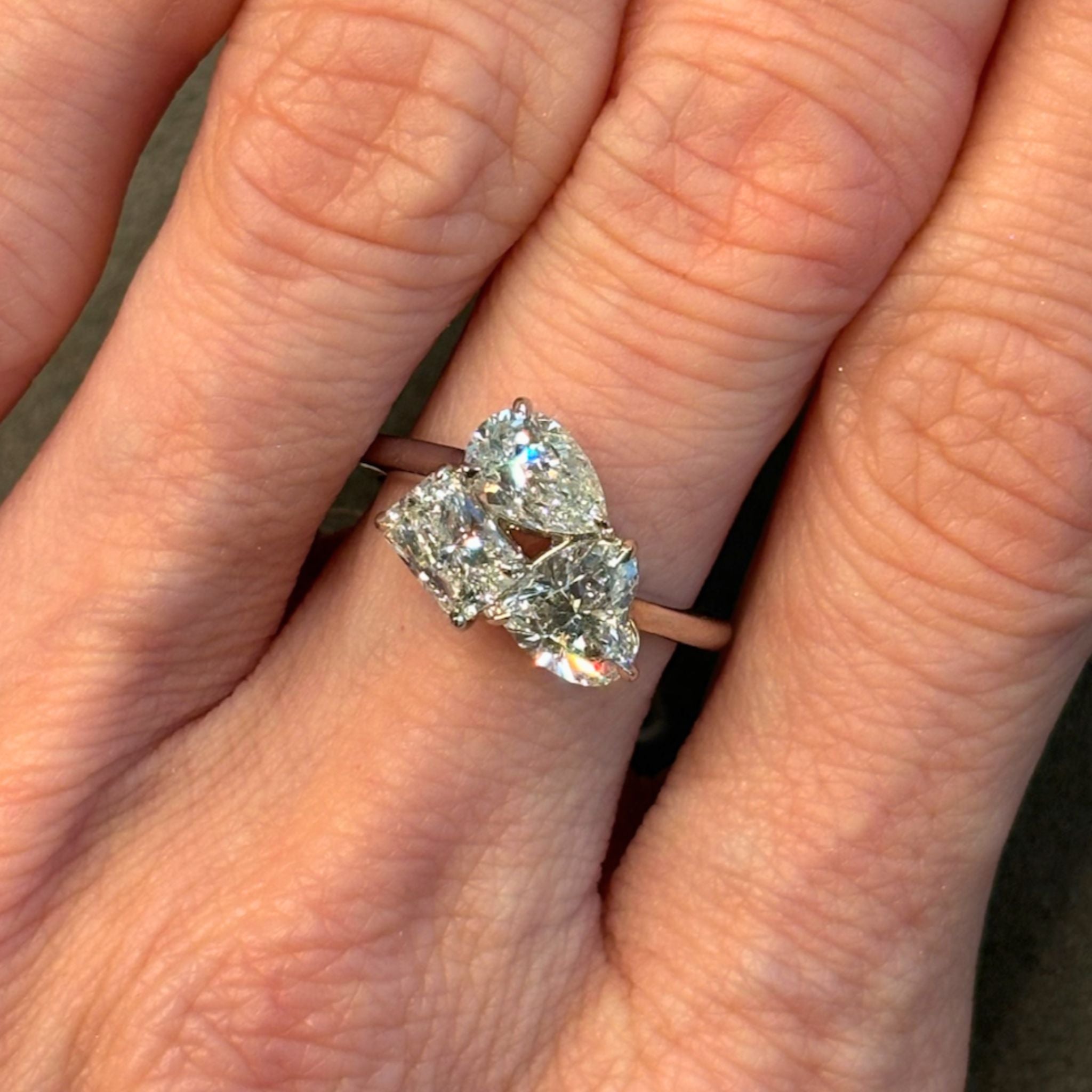 Three Stone Ring in White Gold with Pear Shape, Heart Shape, and Radiant Cut Diamonds