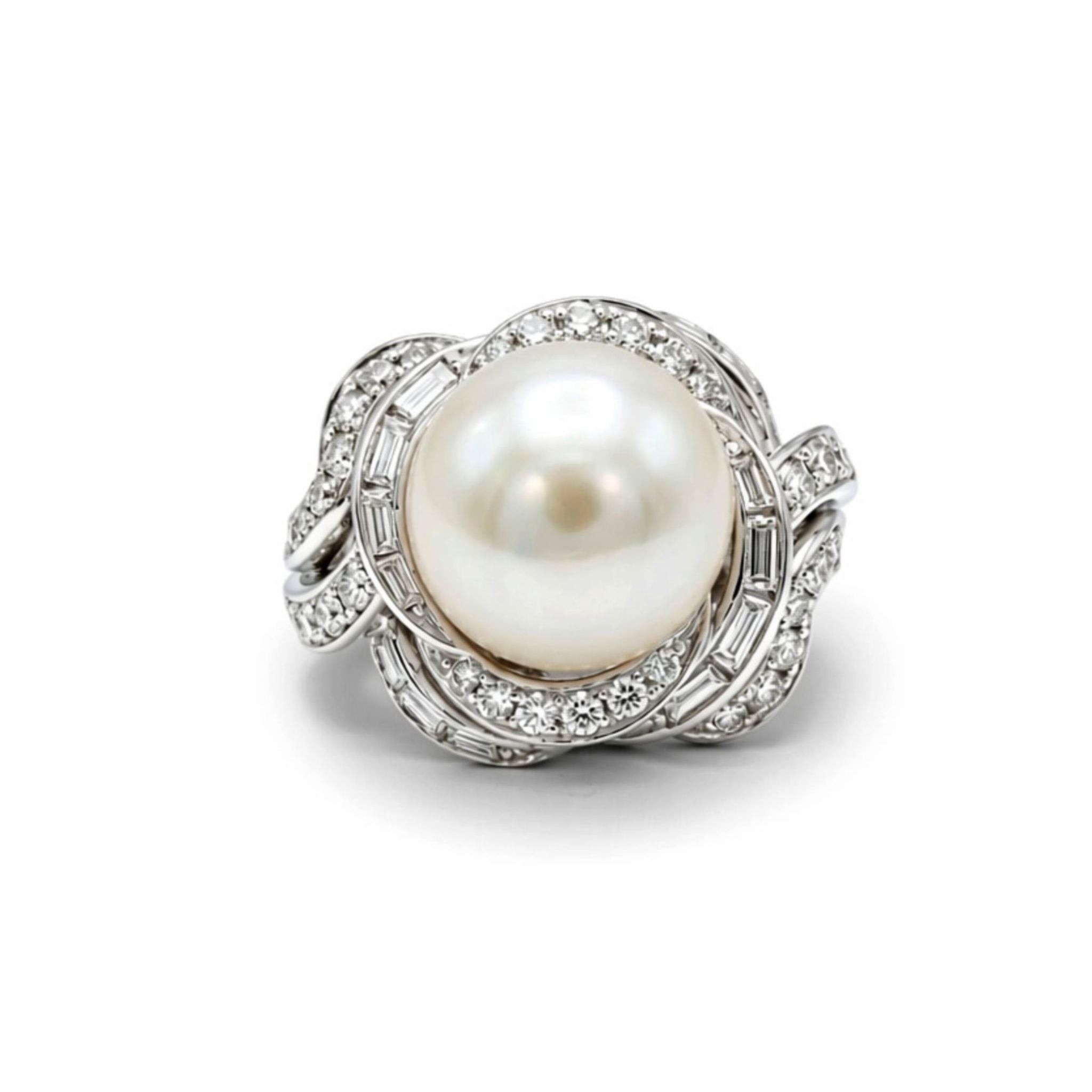 The David Webb Pearl and Diamond Ring features a large cultured pearl at its center, set in 18k white gold with small diamonds in twisted, overlapping bands for an elegant, swirling design.
